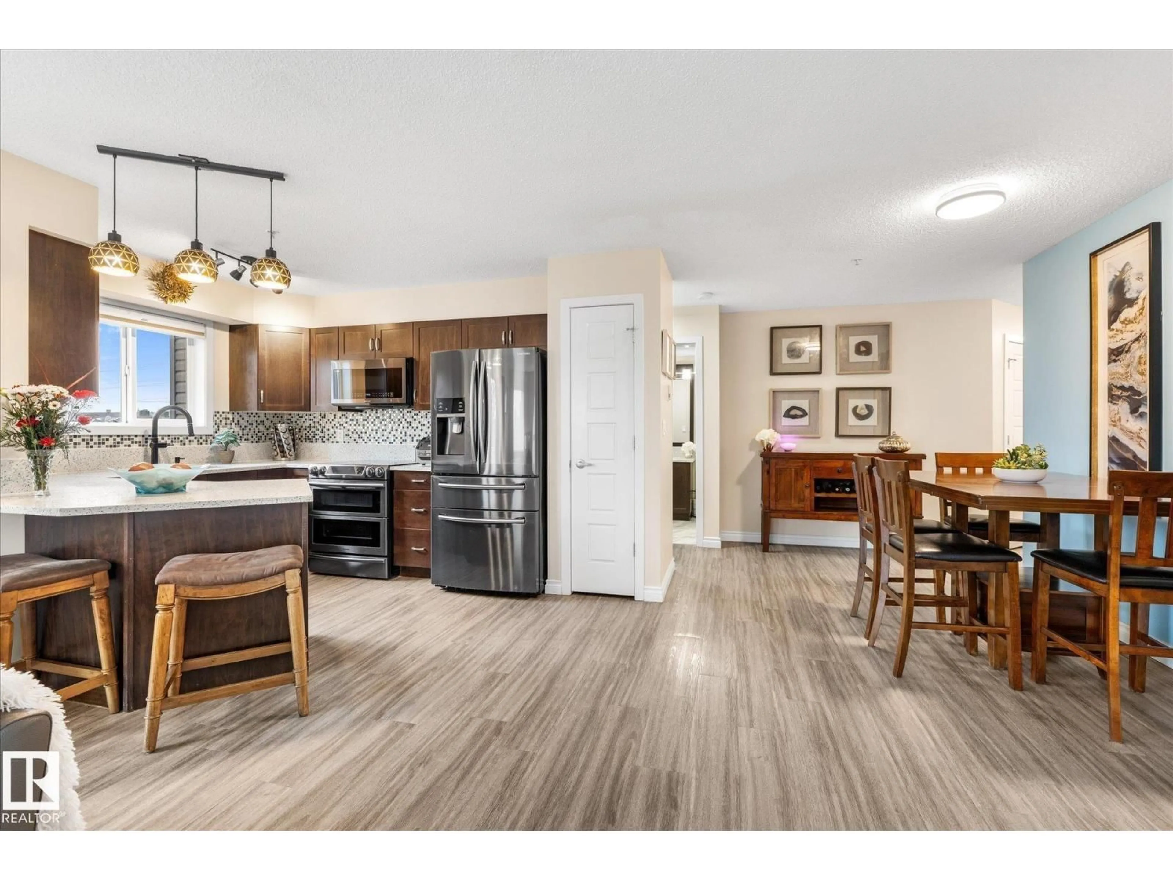 Open concept kitchen, wood/laminate floor for #303 - 396 SILVER BERRY RD, Edmonton Alberta T6T0H1