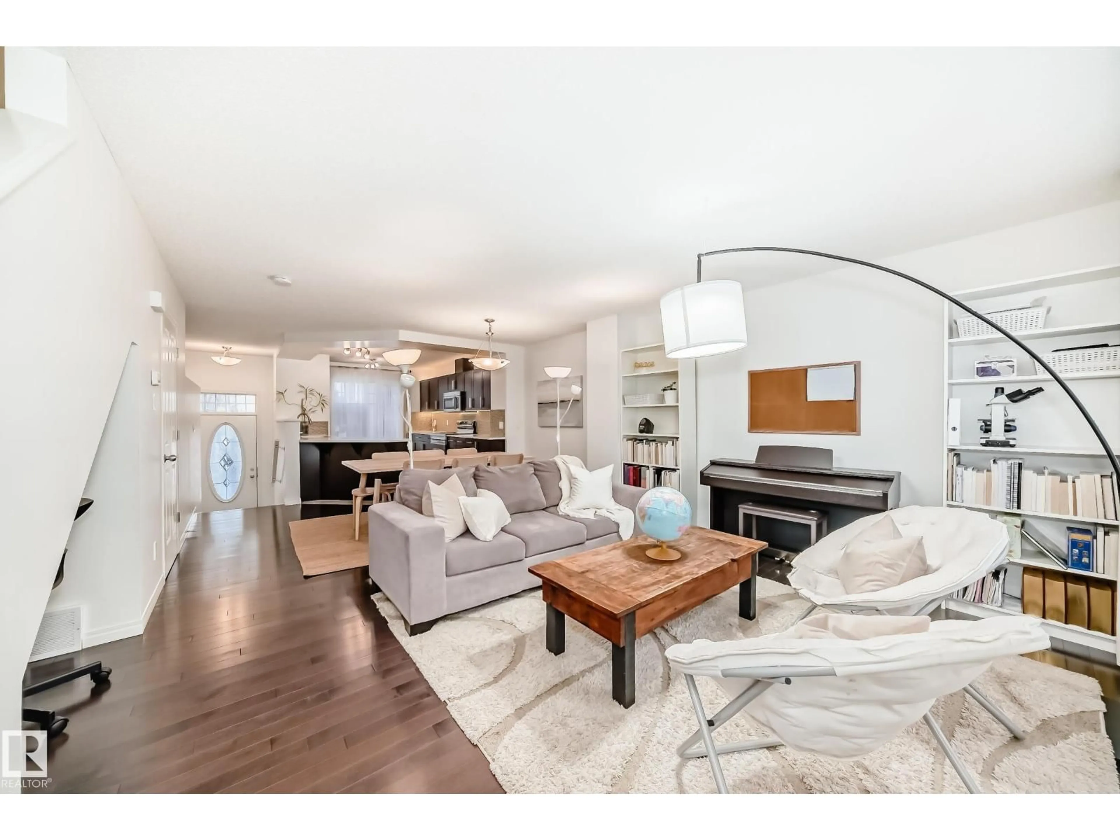 Living room with furniture, wood/laminate floor for 460 - 50 HEMINGWAY RD, Edmonton Alberta T6M0M5