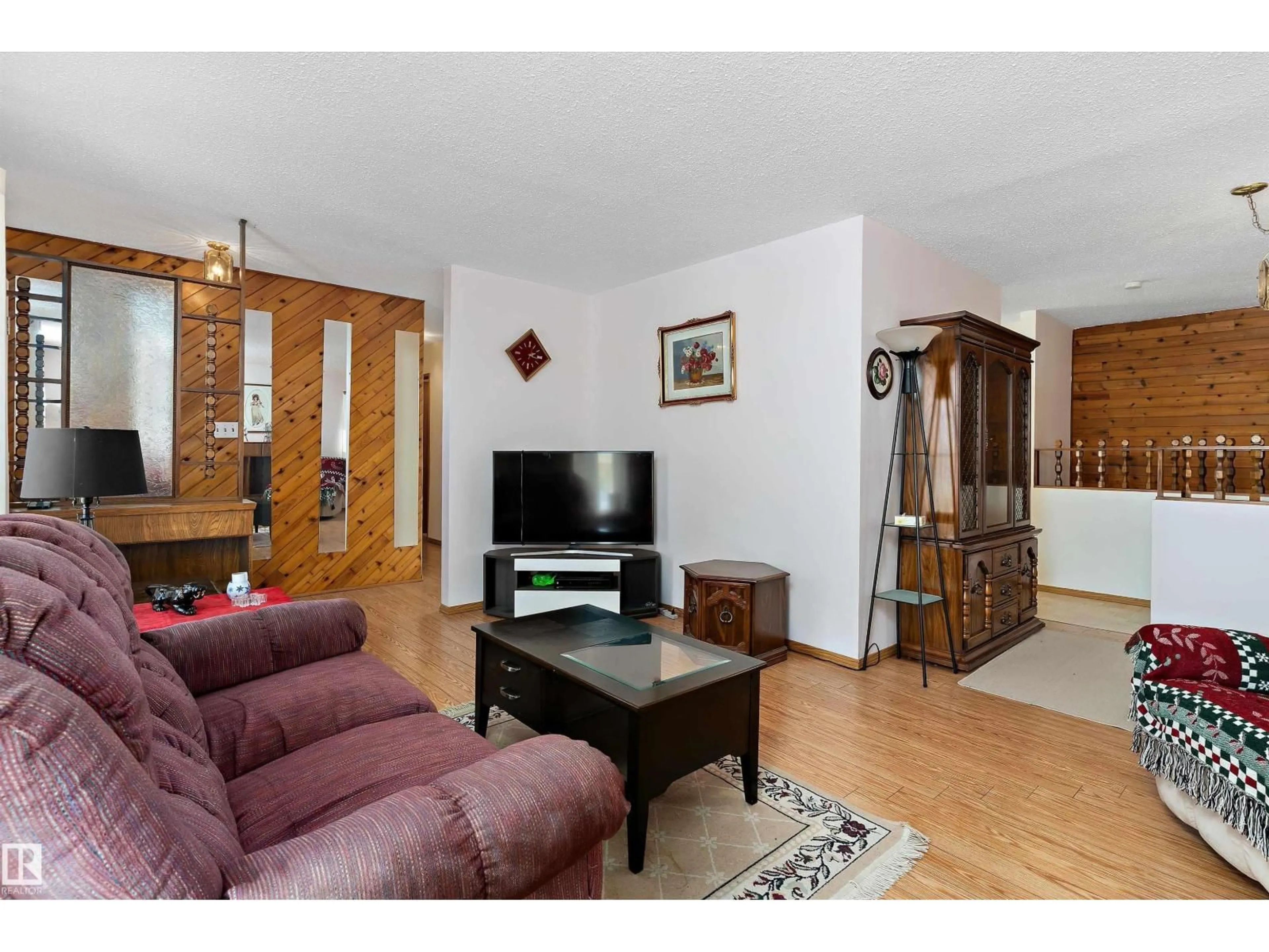 Living room with furniture, wood/laminate floor for 152 CORINTHIA DR, Leduc Alberta T9E4G3