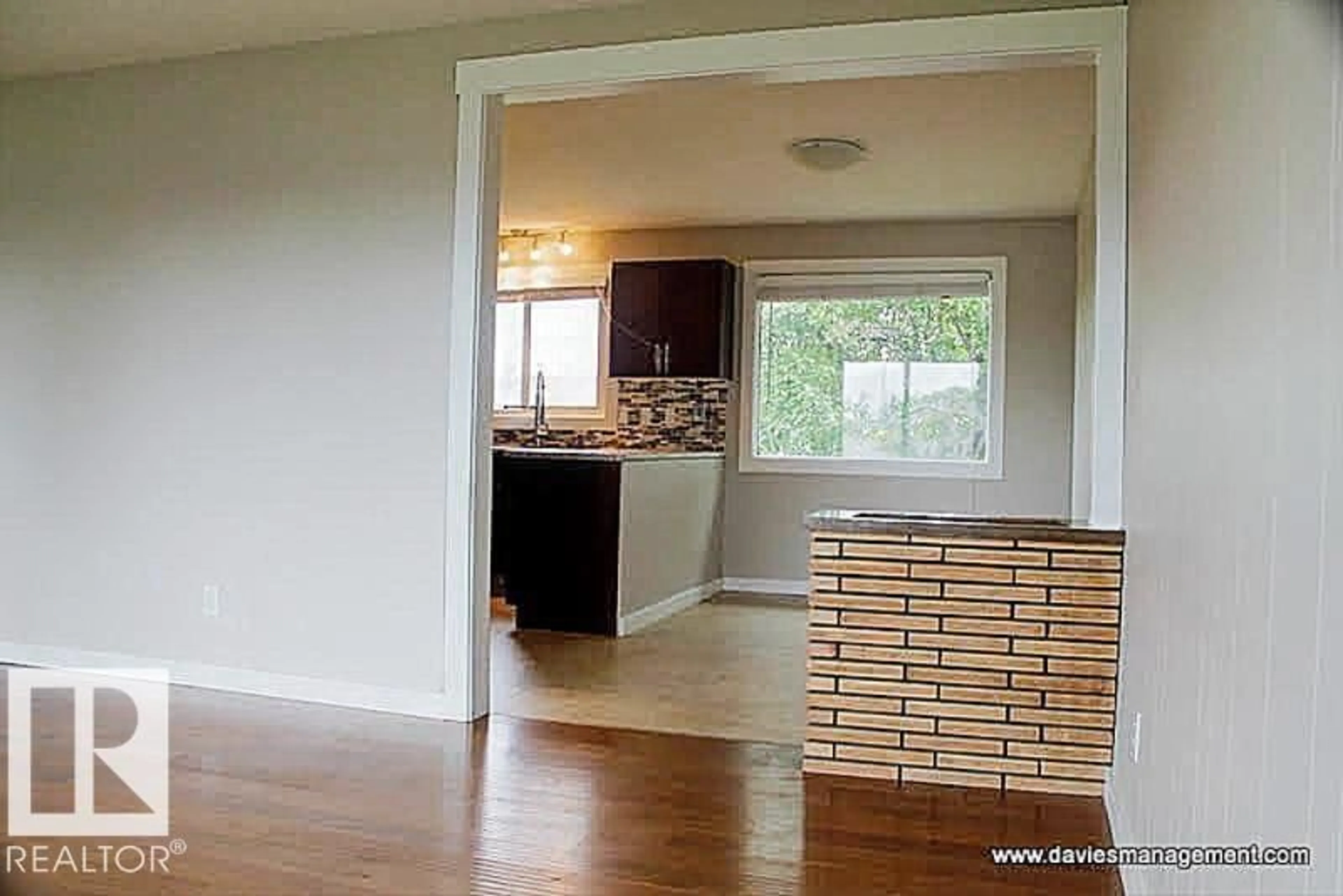 Open concept kitchen, wood/laminate floor for 9412 134 AV, Edmonton Alberta T5E1H7