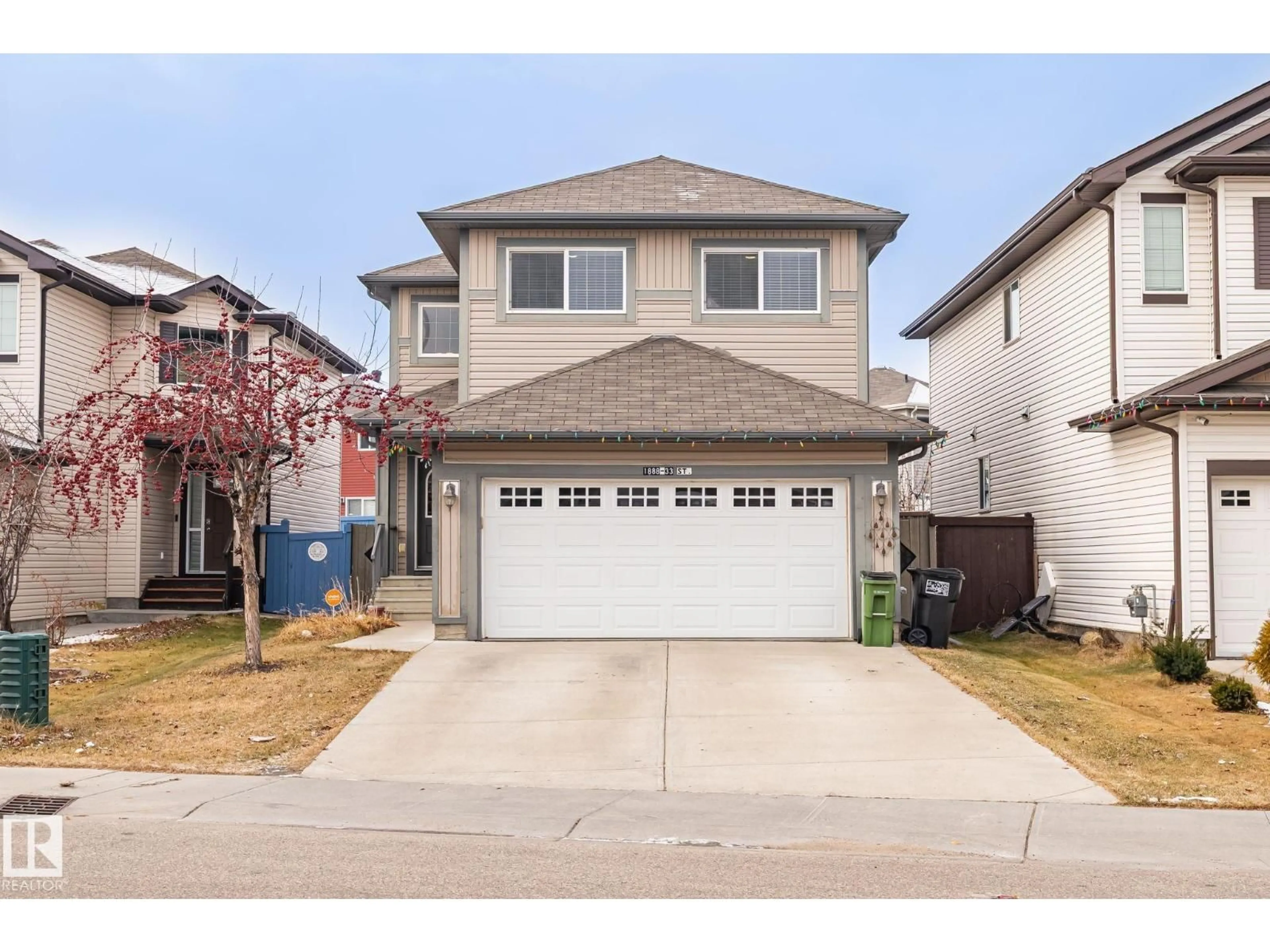 Home with vinyl exterior material, street for NW - 1888 33 ST, Edmonton Alberta T6T0L5