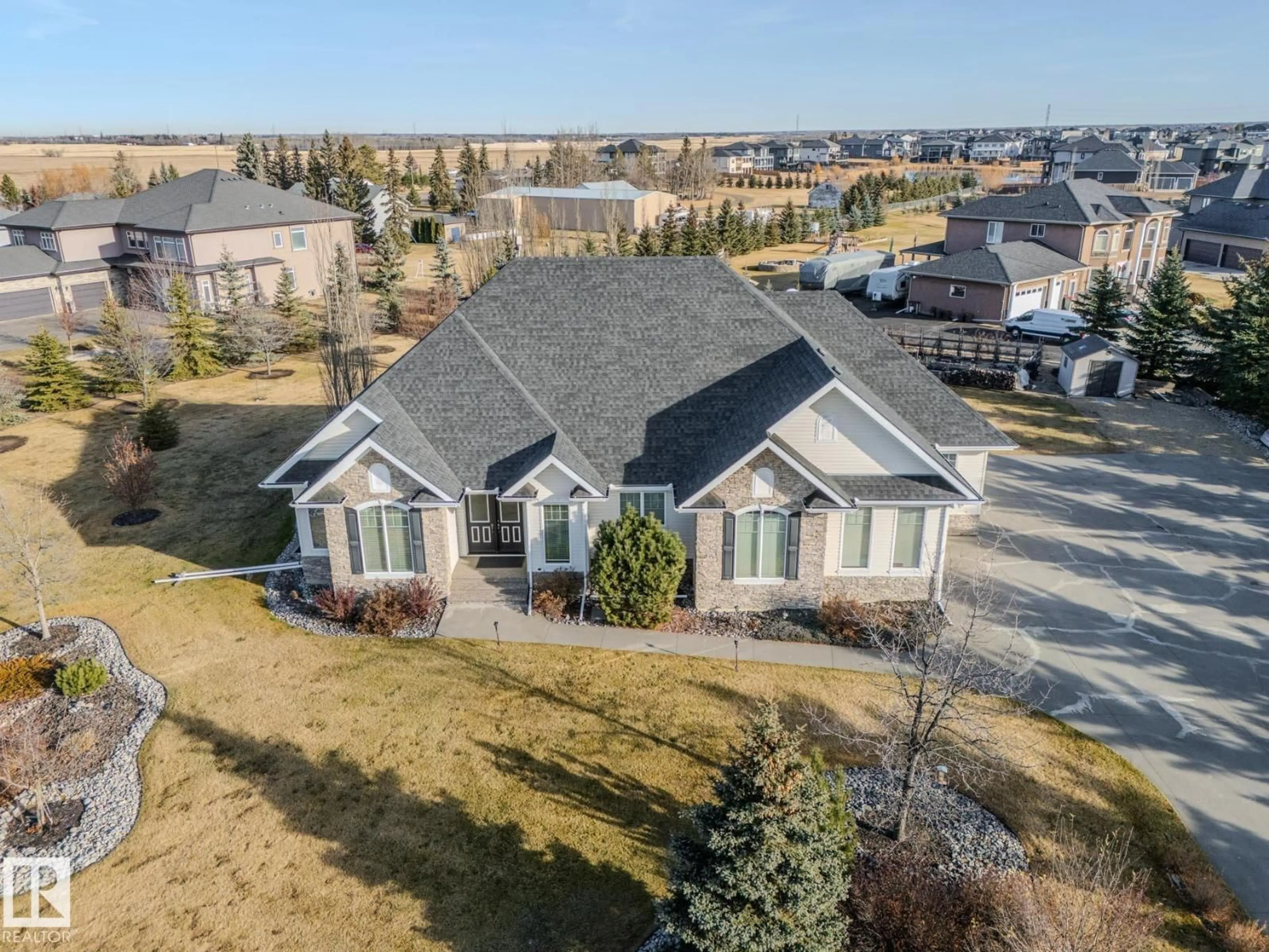 A pic from outside/outdoor area/front of a property/back of a property/a pic from drone, street for 60 50565 RGE RD 245, Rural Leduc County Alberta T4X0P5