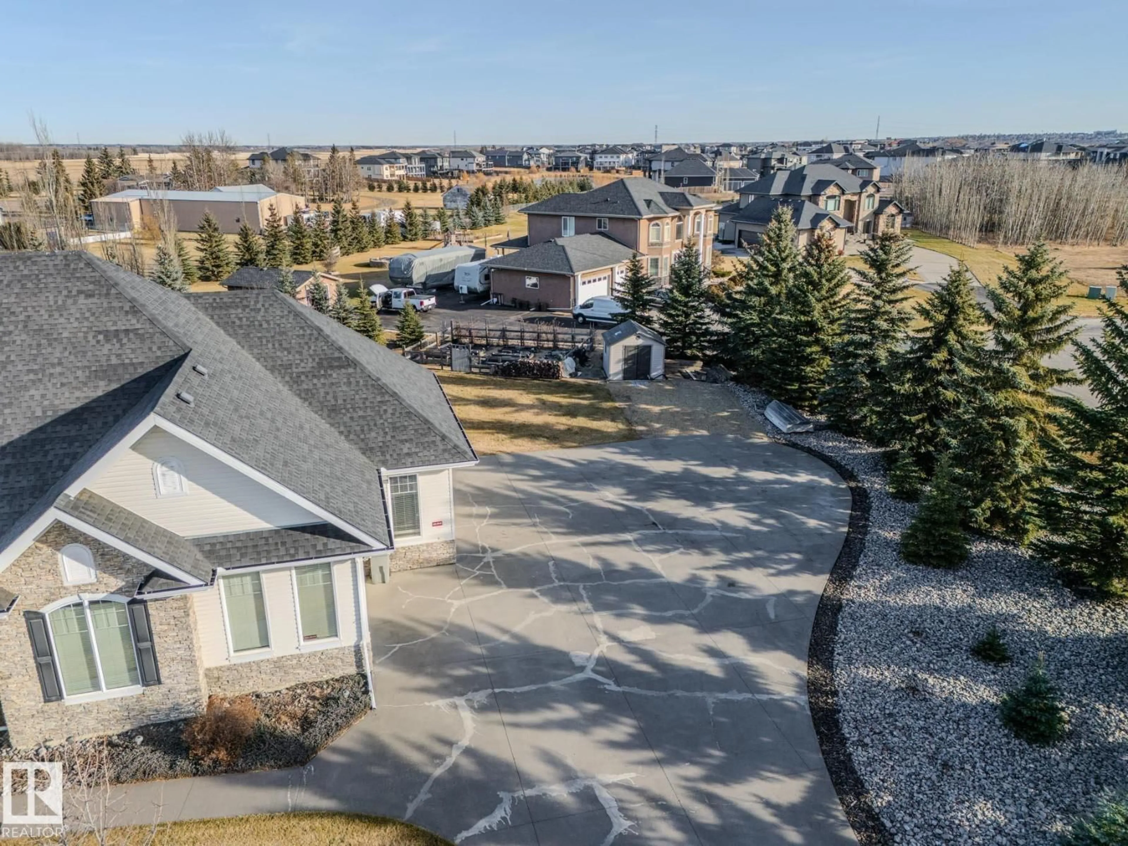 A pic from outside/outdoor area/front of a property/back of a property/a pic from drone, unknown for 60 50565 RGE RD 245, Rural Leduc County Alberta T4X0P5