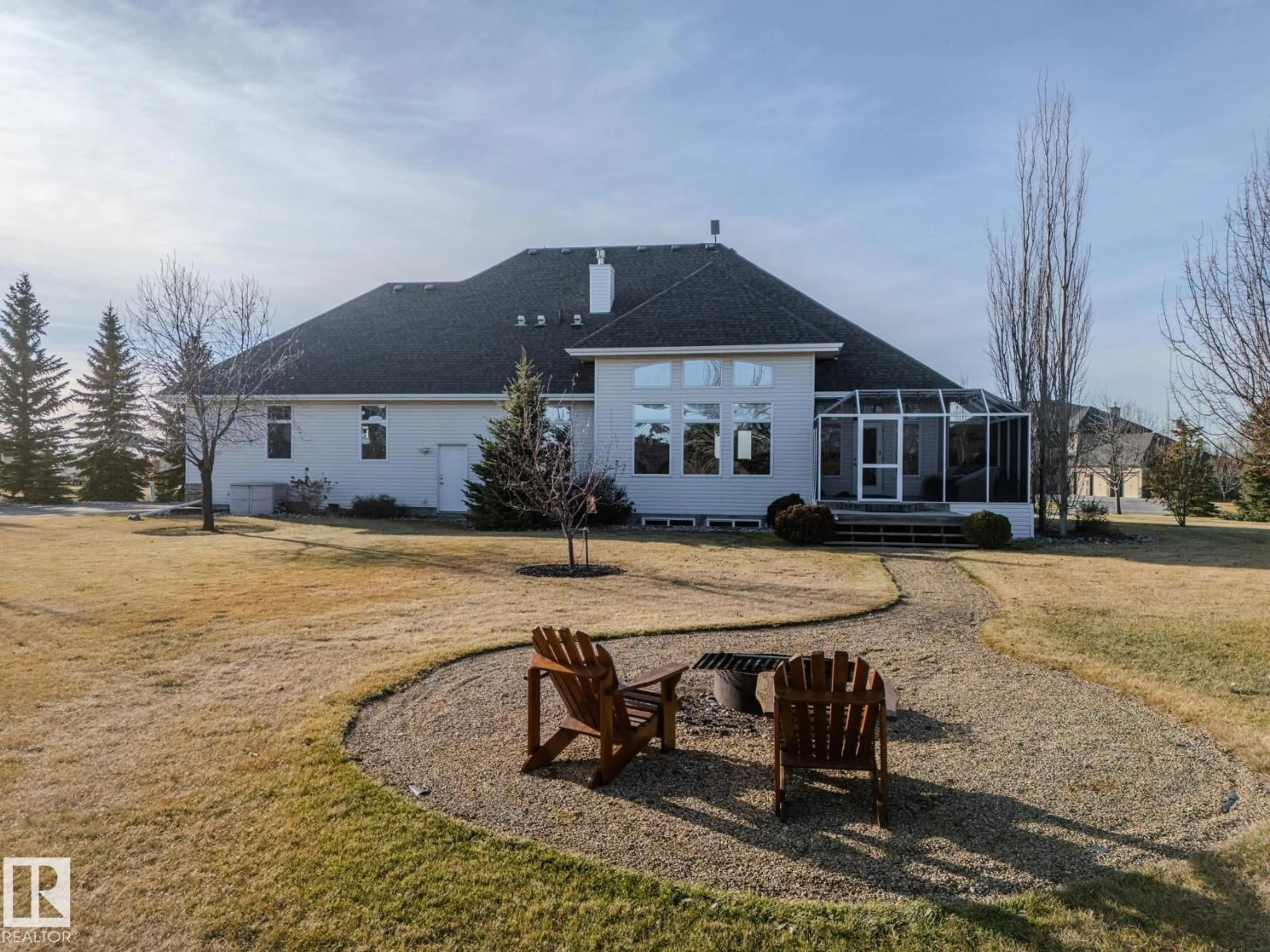 A pic from outside/outdoor area/front of a property/back of a property/a pic from drone, mountain view for 60 50565 RGE RD 245, Rural Leduc County Alberta T4X0P5