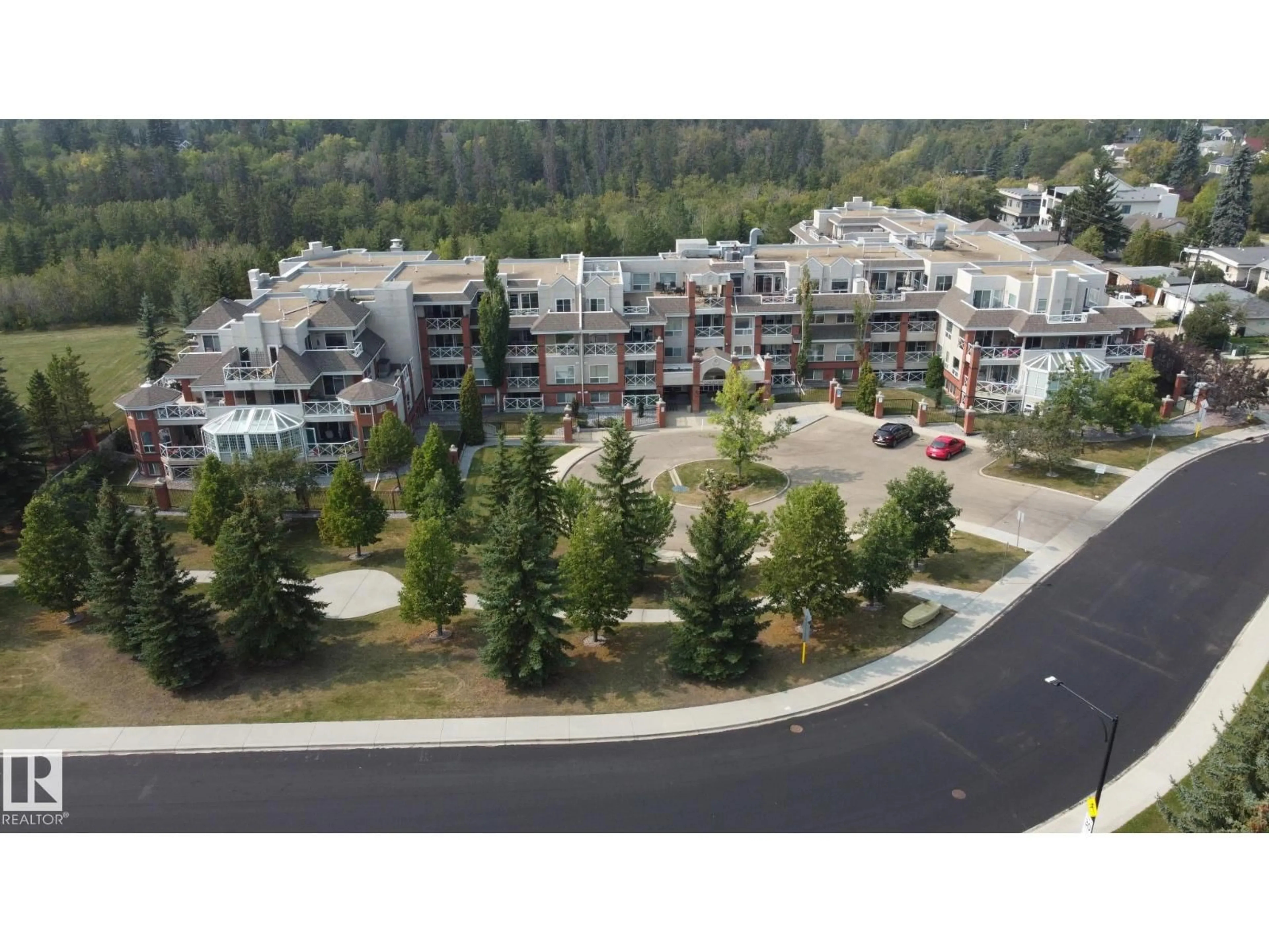 A pic from outside/outdoor area/front of a property/back of a property/a pic from drone, mountain view for #325 - 7510 89 ST, Edmonton Alberta T6C0X5
