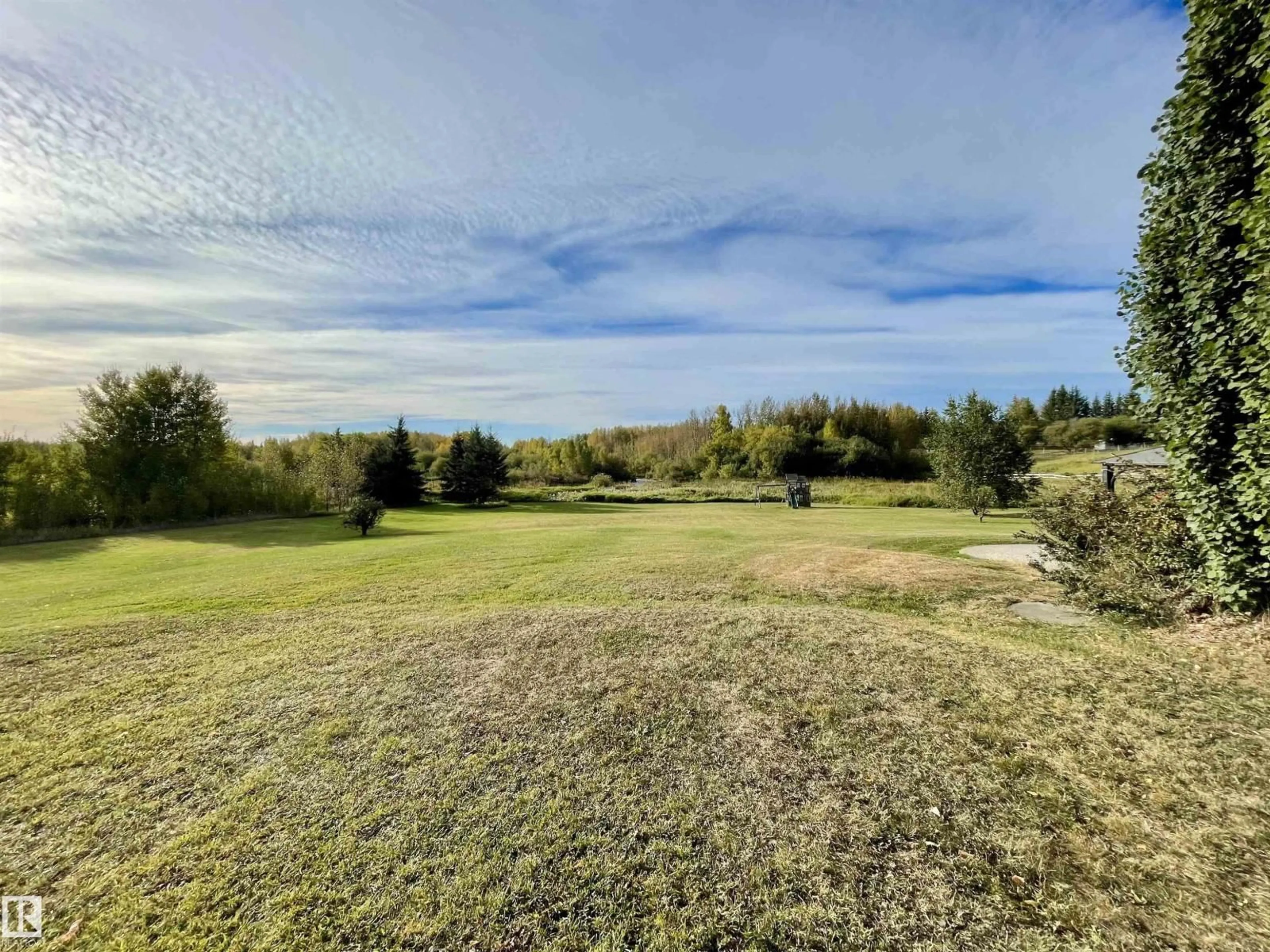 A pic from outside/outdoor area/front of a property/back of a property/a pic from drone, water/lake/river/ocean view for 2401 TWP ROAD 524, Rural Parkland County Alberta T7Y2K8