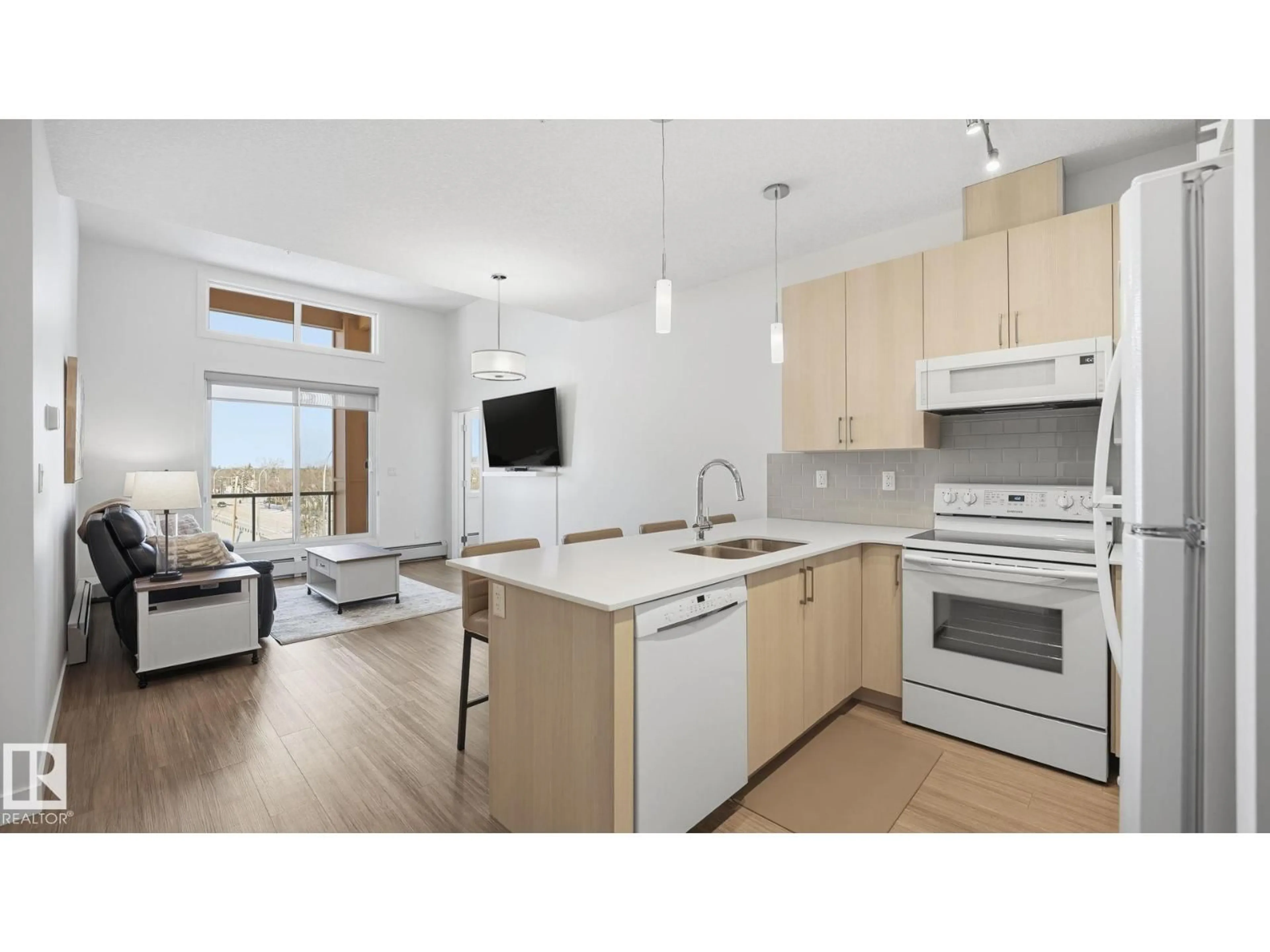 Open concept kitchen, wood/laminate floor for 401 17 COLUMBIA AVENUE, Devon Alberta T9G1Y7