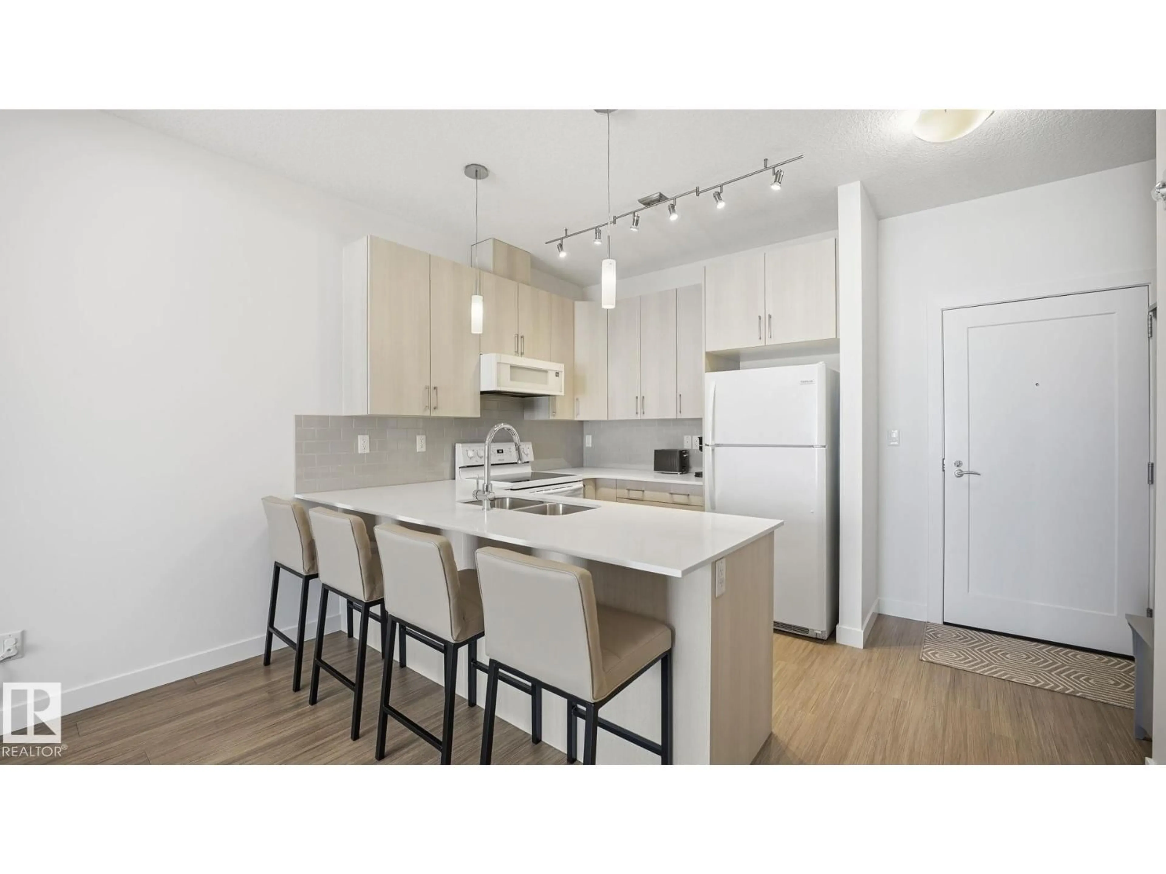 Open concept kitchen, wood/laminate floor for 401 17 COLUMBIA AVENUE, Devon Alberta T9G1Y7