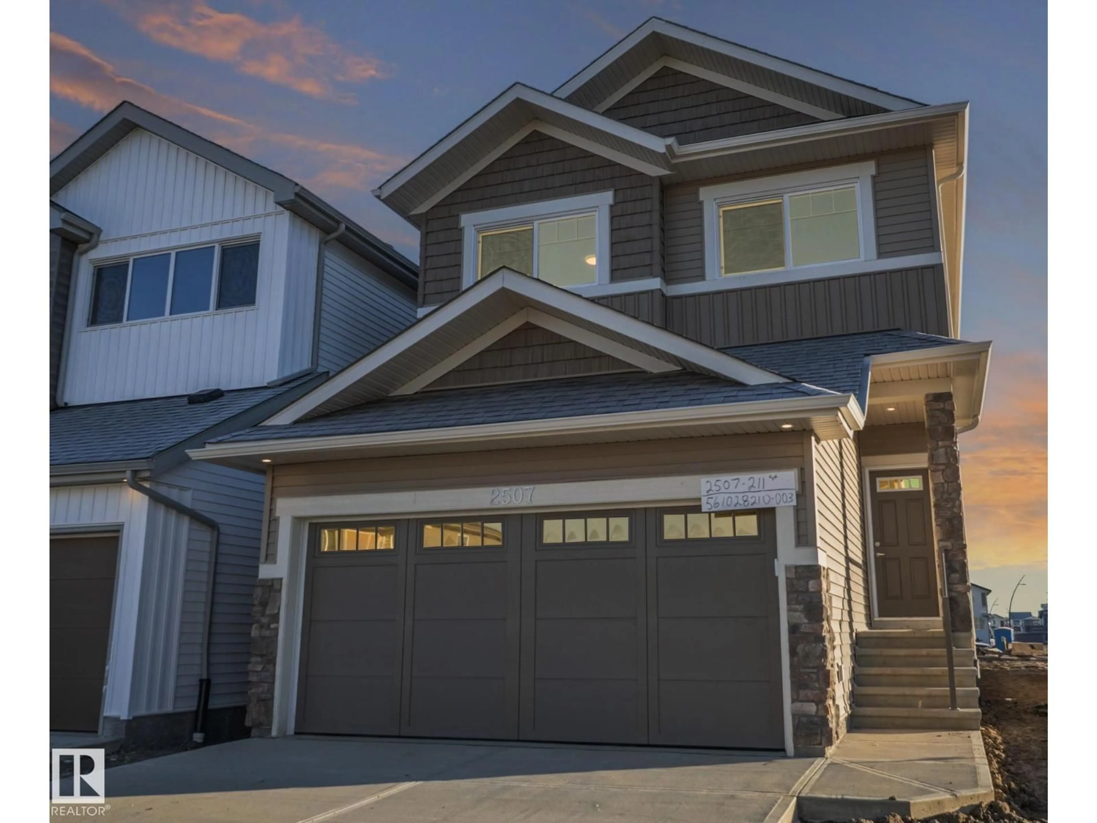 Home with vinyl exterior material, street for NW - 2507 211 ST, Edmonton Alberta T6M3H1