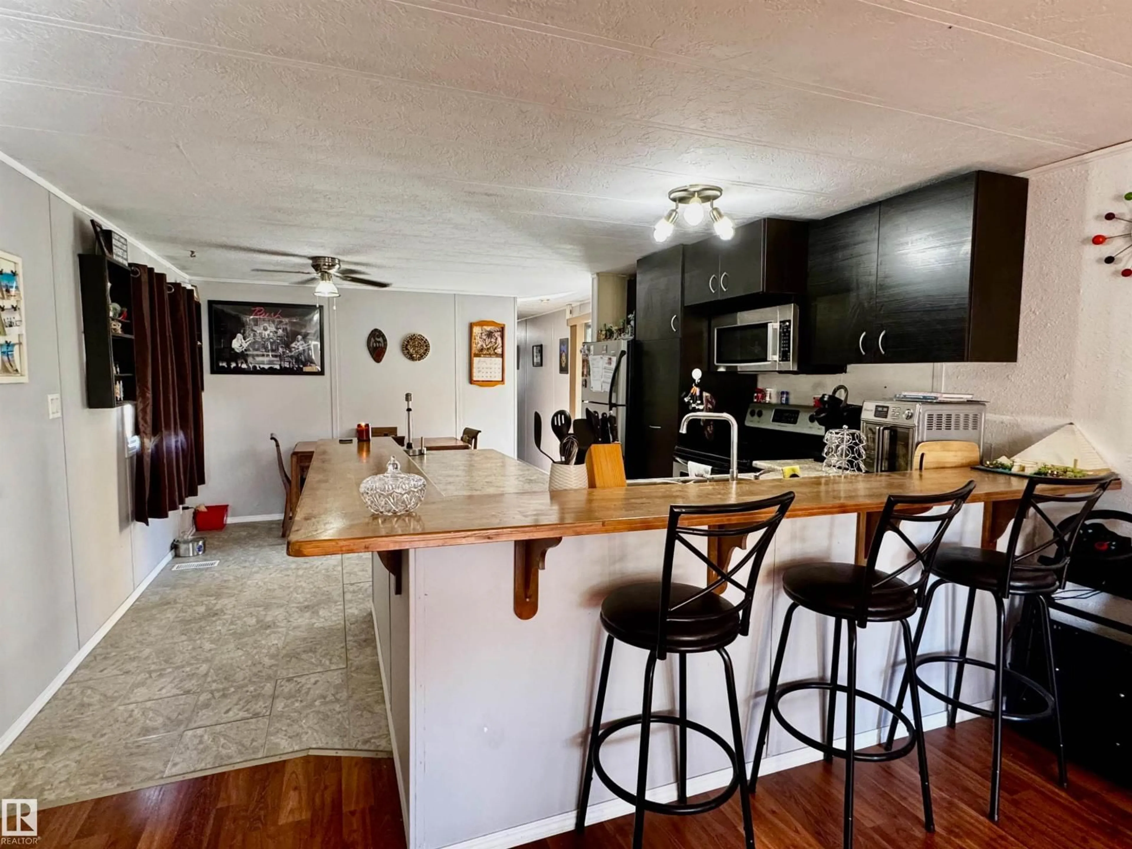 Open concept kitchen, wood/laminate floor for 17 - 2251 50 ST, Drayton Valley Alberta T7A1M7