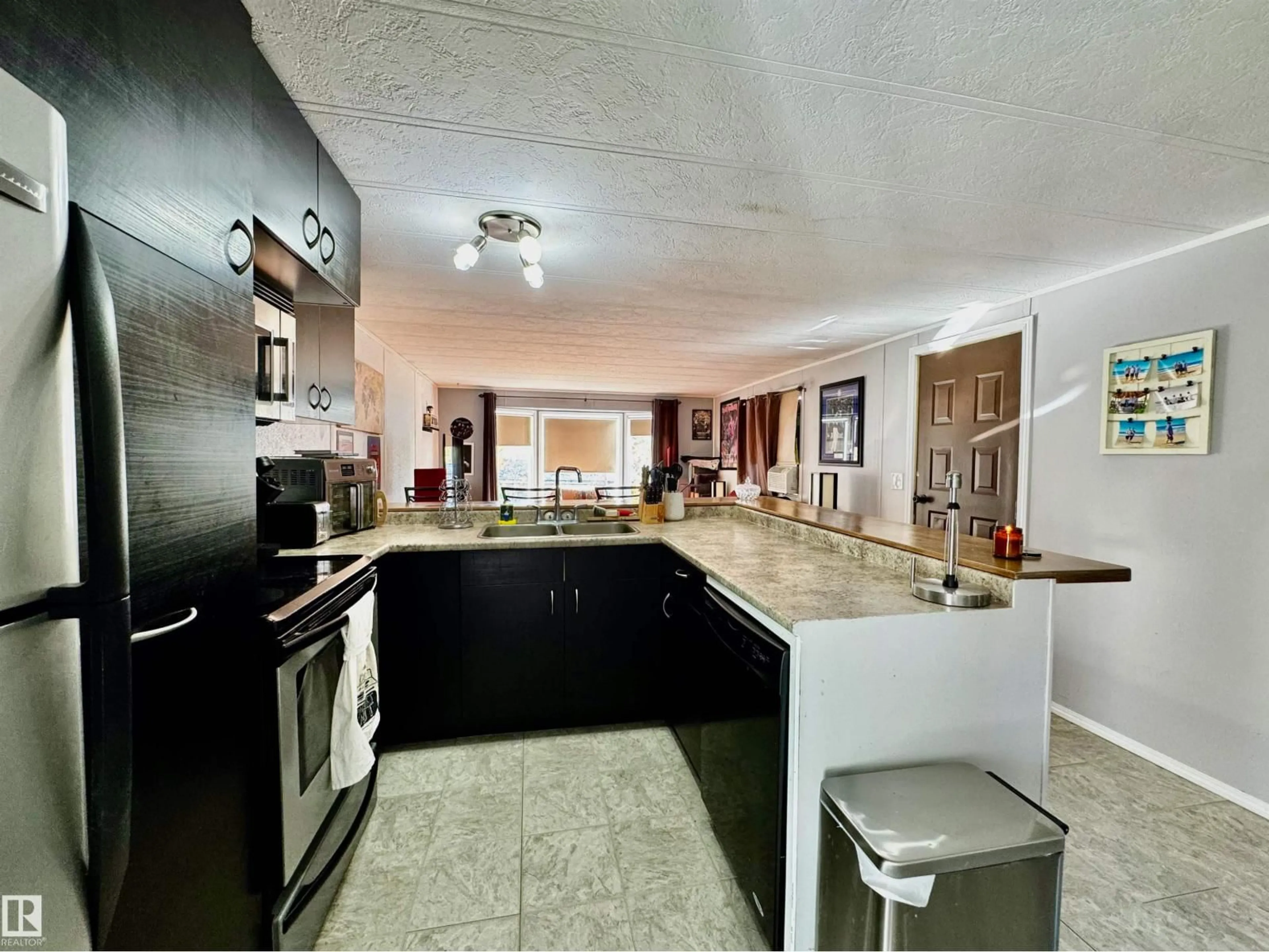 Open concept kitchen, ceramic/tile floor for 17 - 2251 50 ST, Drayton Valley Alberta T7A1M7