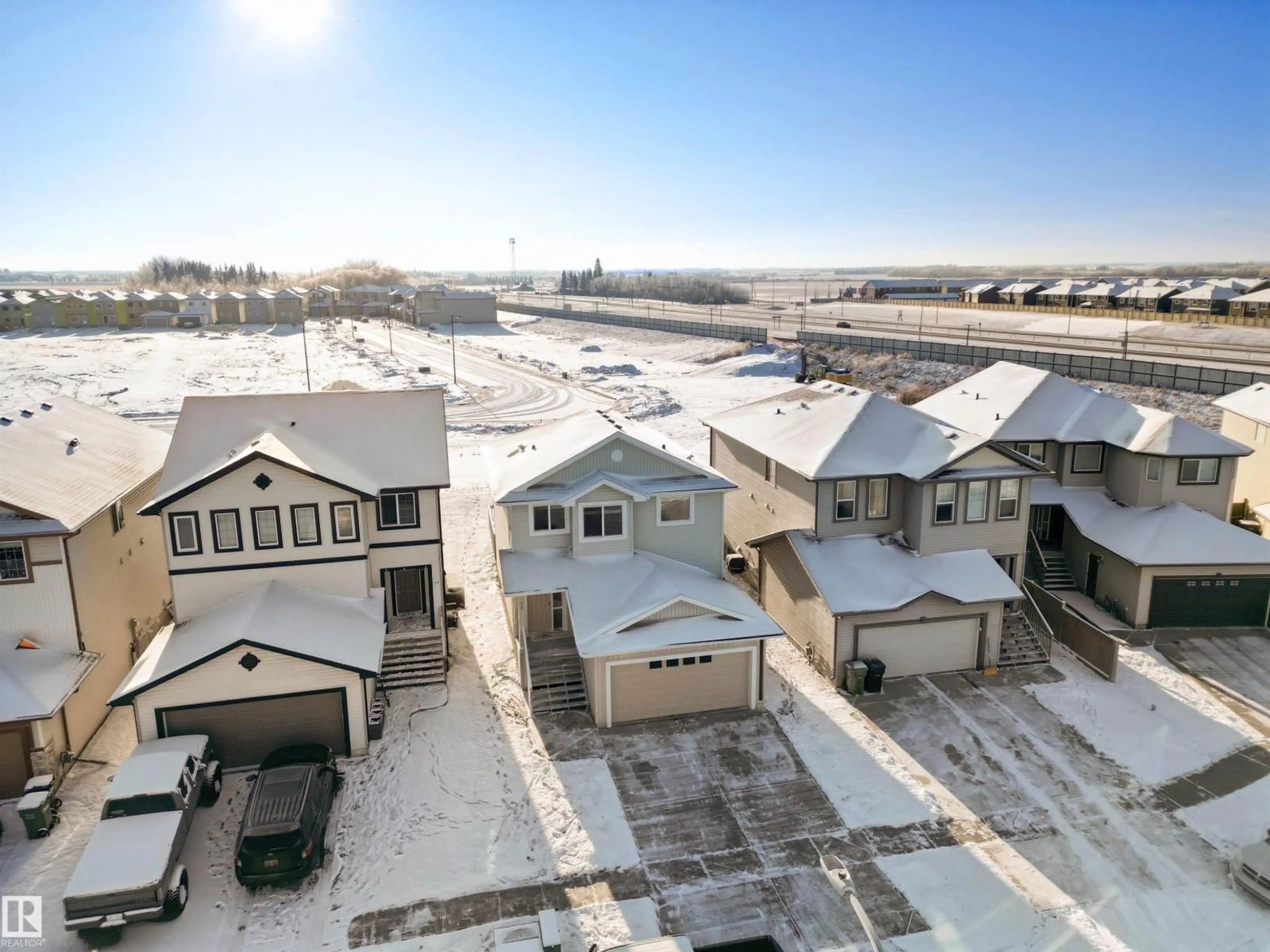 A pic from outside/outdoor area/front of a property/back of a property/a pic from drone, street for 75 DUNLOP WD, Leduc Alberta T9E0N3