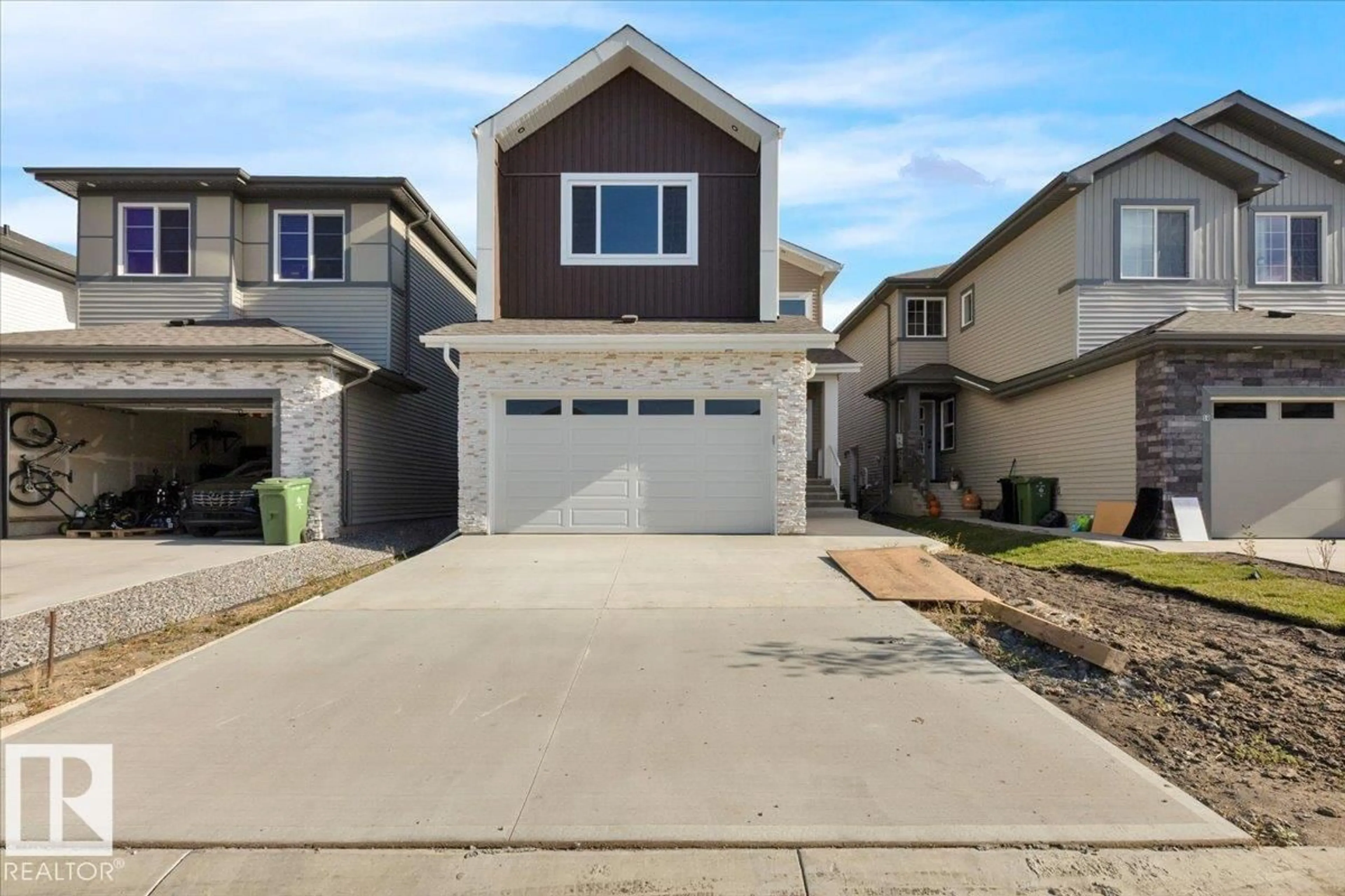 Home with vinyl exterior material, street for 63 WAVERLY WY, Fort Saskatchewan Alberta T8L0Z8