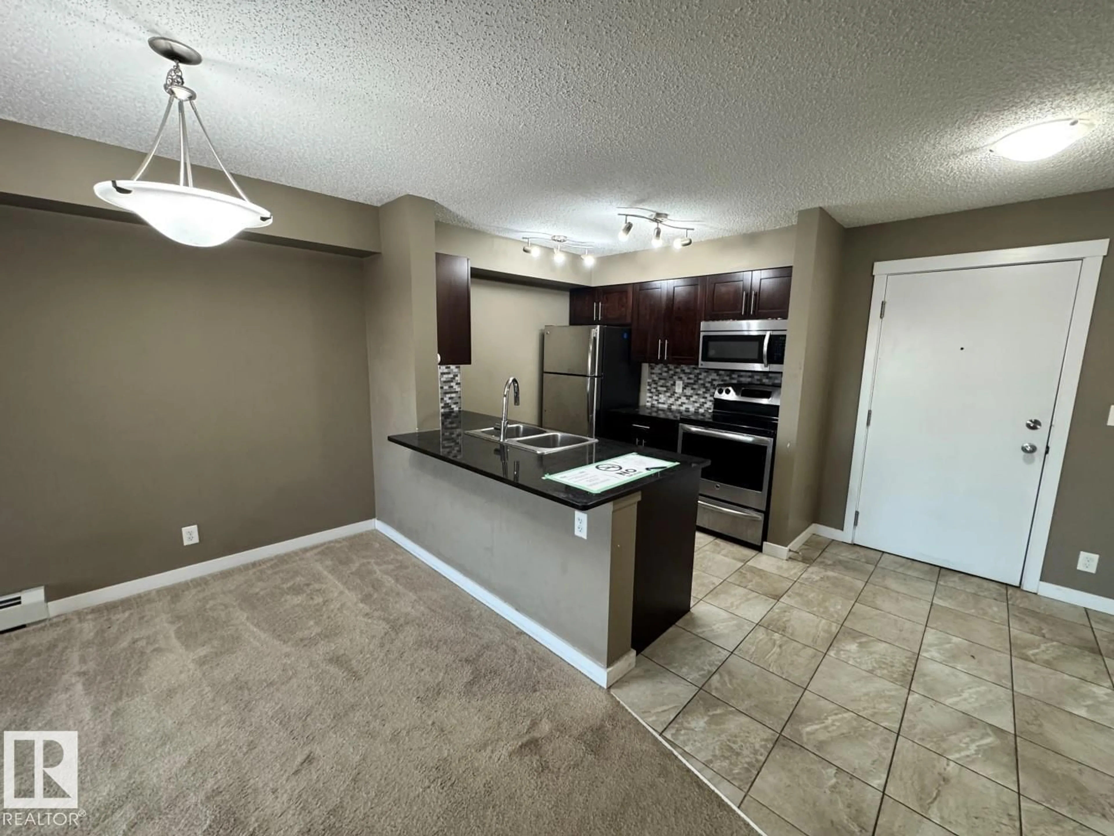 Open concept kitchen, unknown for 107 - 421 WATT CM, Edmonton Alberta T6X2C6