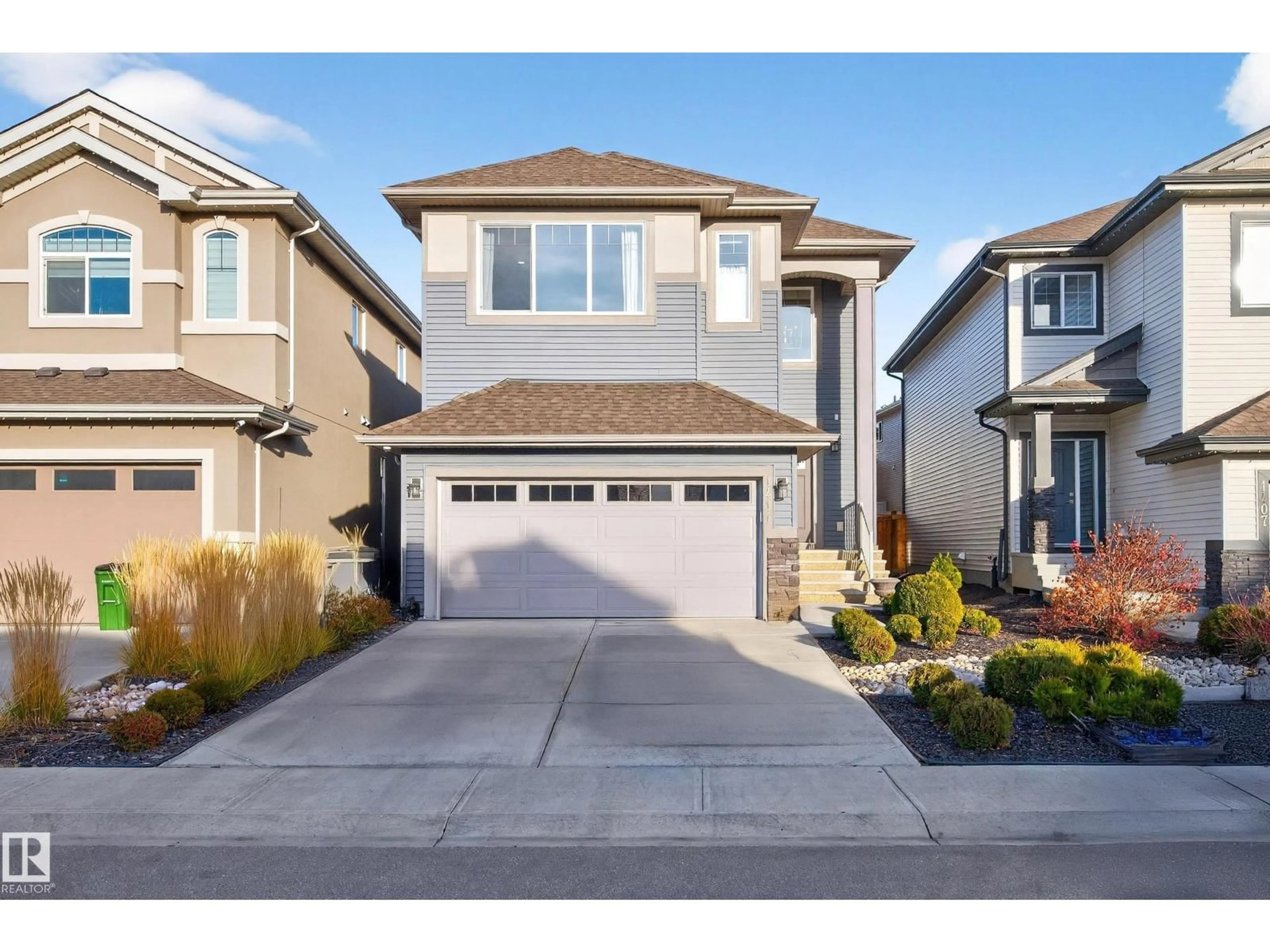 Home with vinyl exterior material, street for NW - 1411 25 ST, Edmonton Alberta T6T2K7