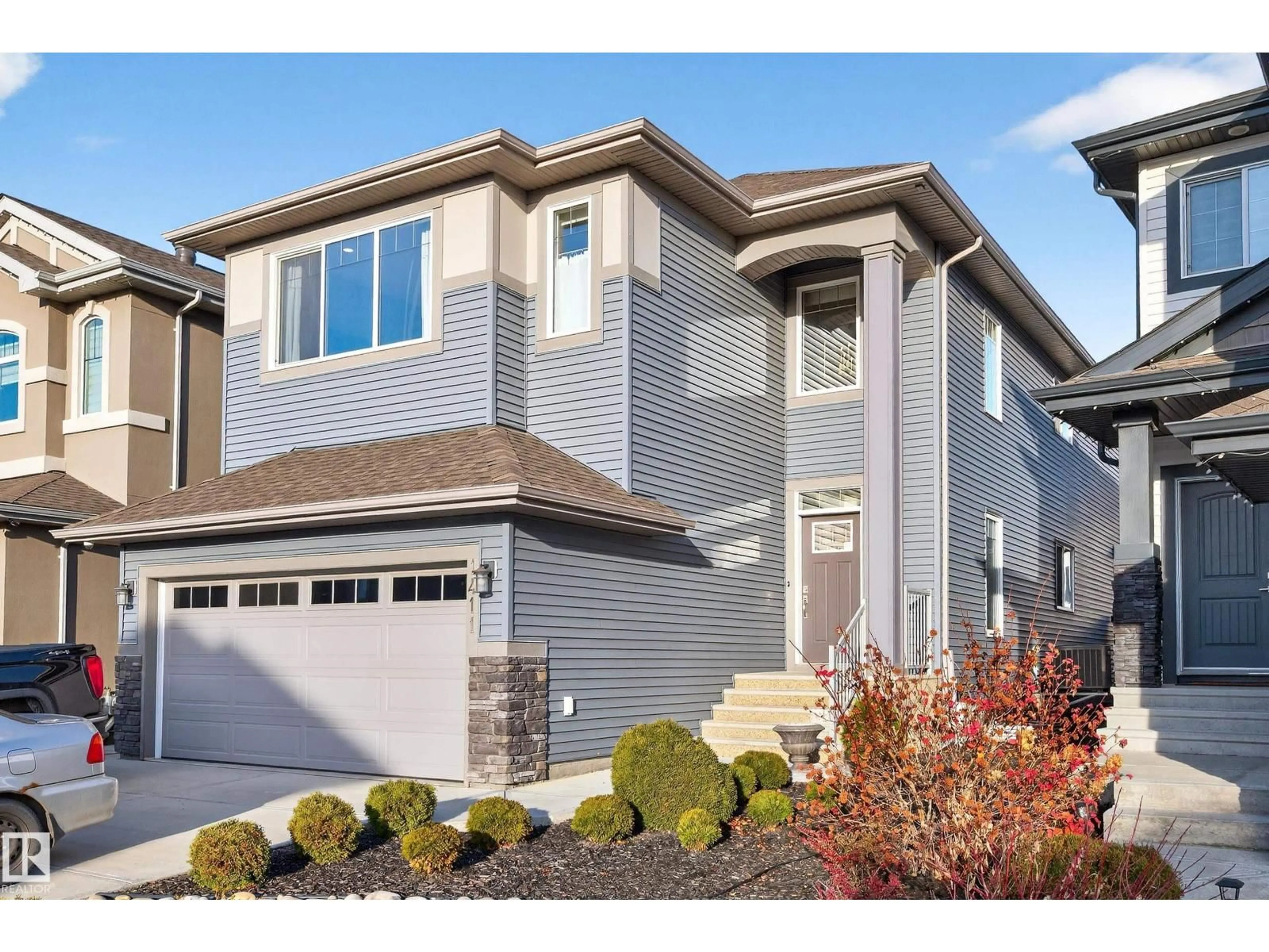 Home with vinyl exterior material, street for NW - 1411 25 ST, Edmonton Alberta T6T2K7