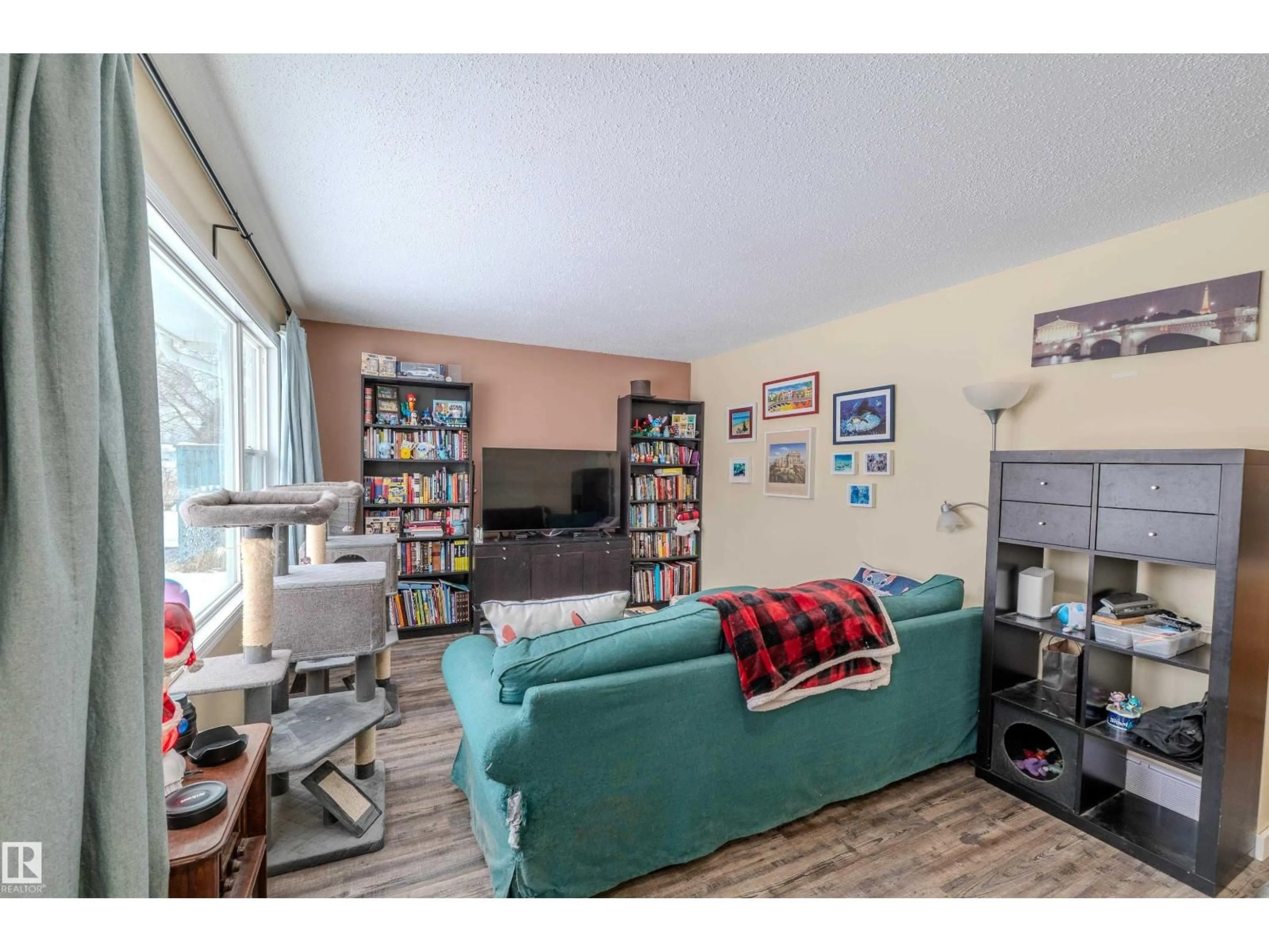 Living room with furniture, wood/laminate floor for 4913 46 ST, Drayton Valley Alberta T7A1H4