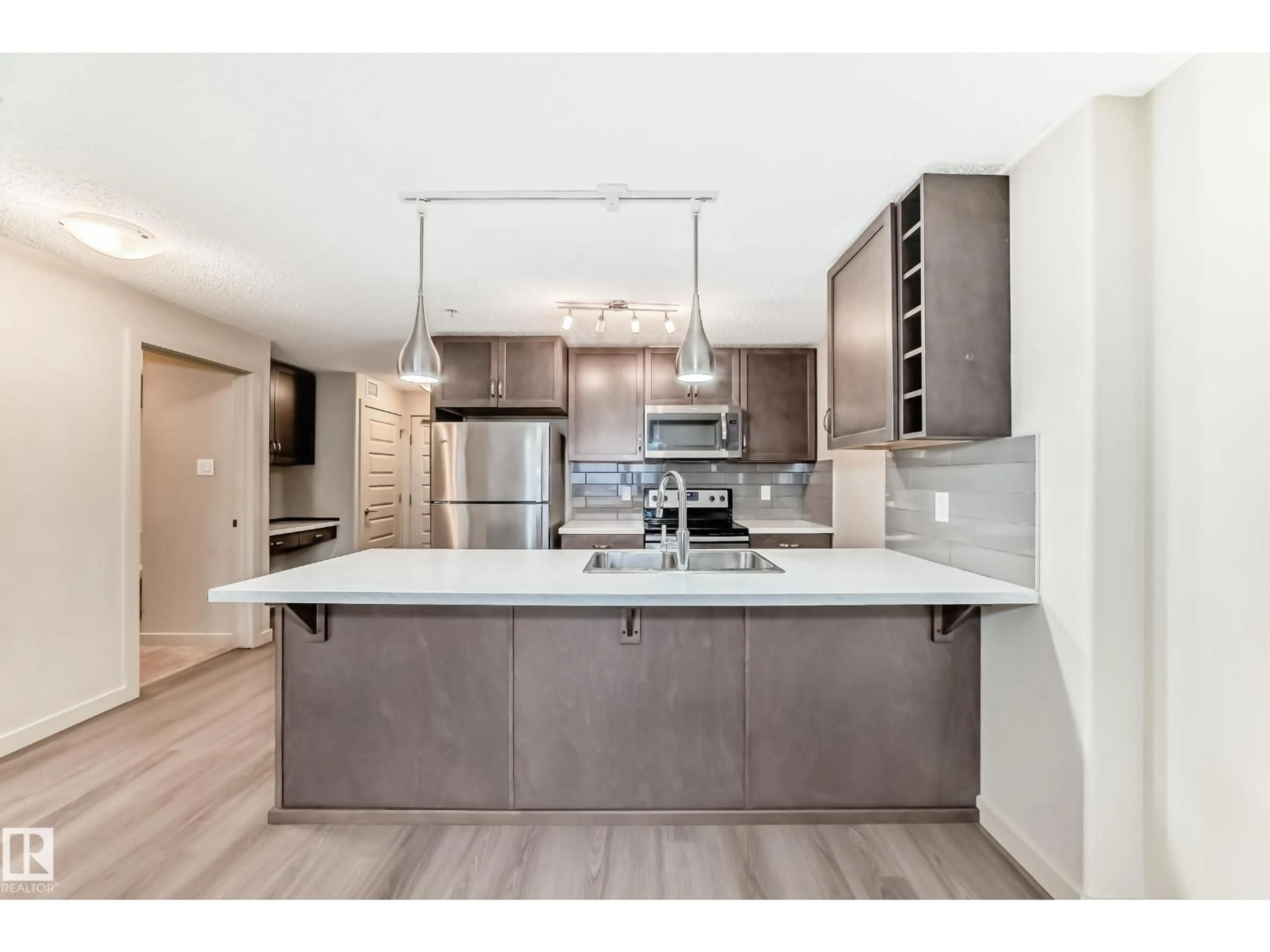 Open concept kitchen, unknown for #303 - 4008 SAVARYN DR, Edmonton Alberta T6X2E5