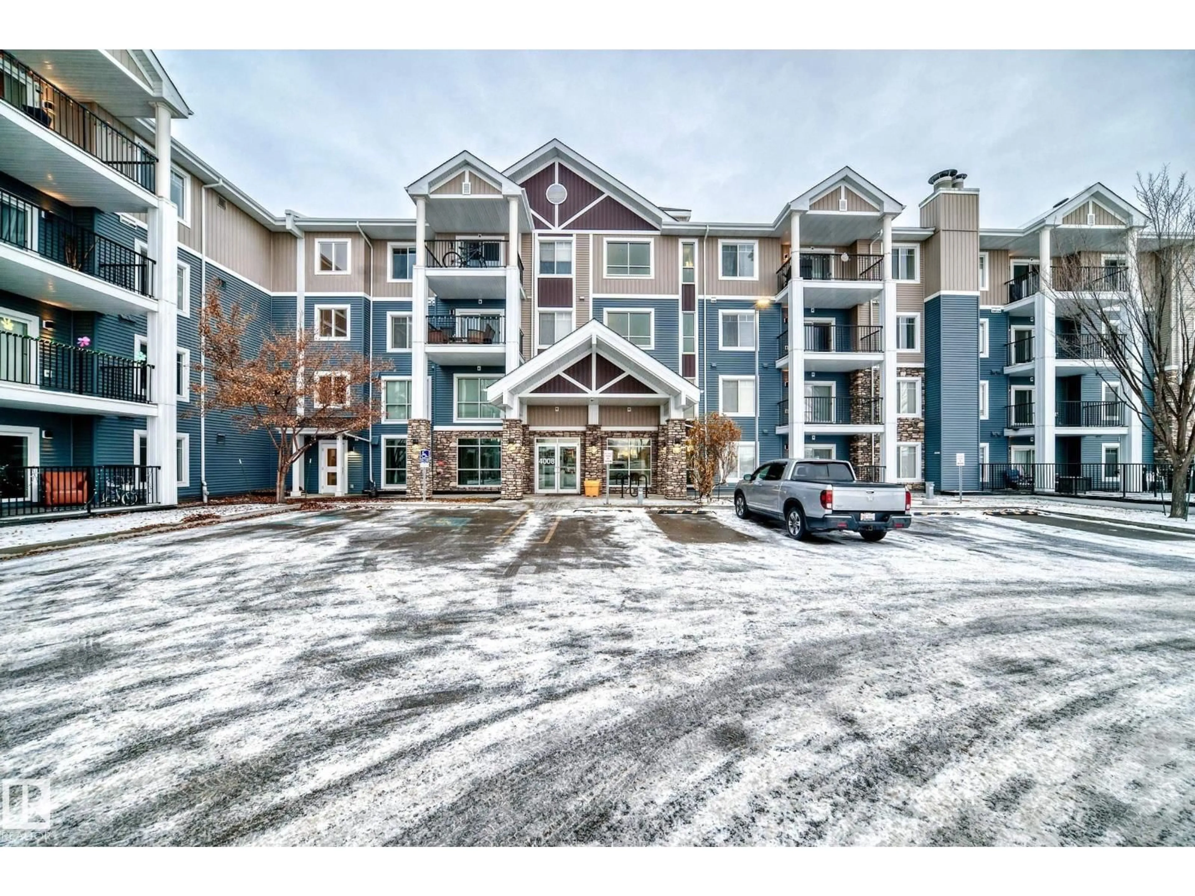 A pic from outside/outdoor area/front of a property/back of a property/a pic from drone, mountain view for #303 - 4008 SAVARYN DR, Edmonton Alberta T6X2E5