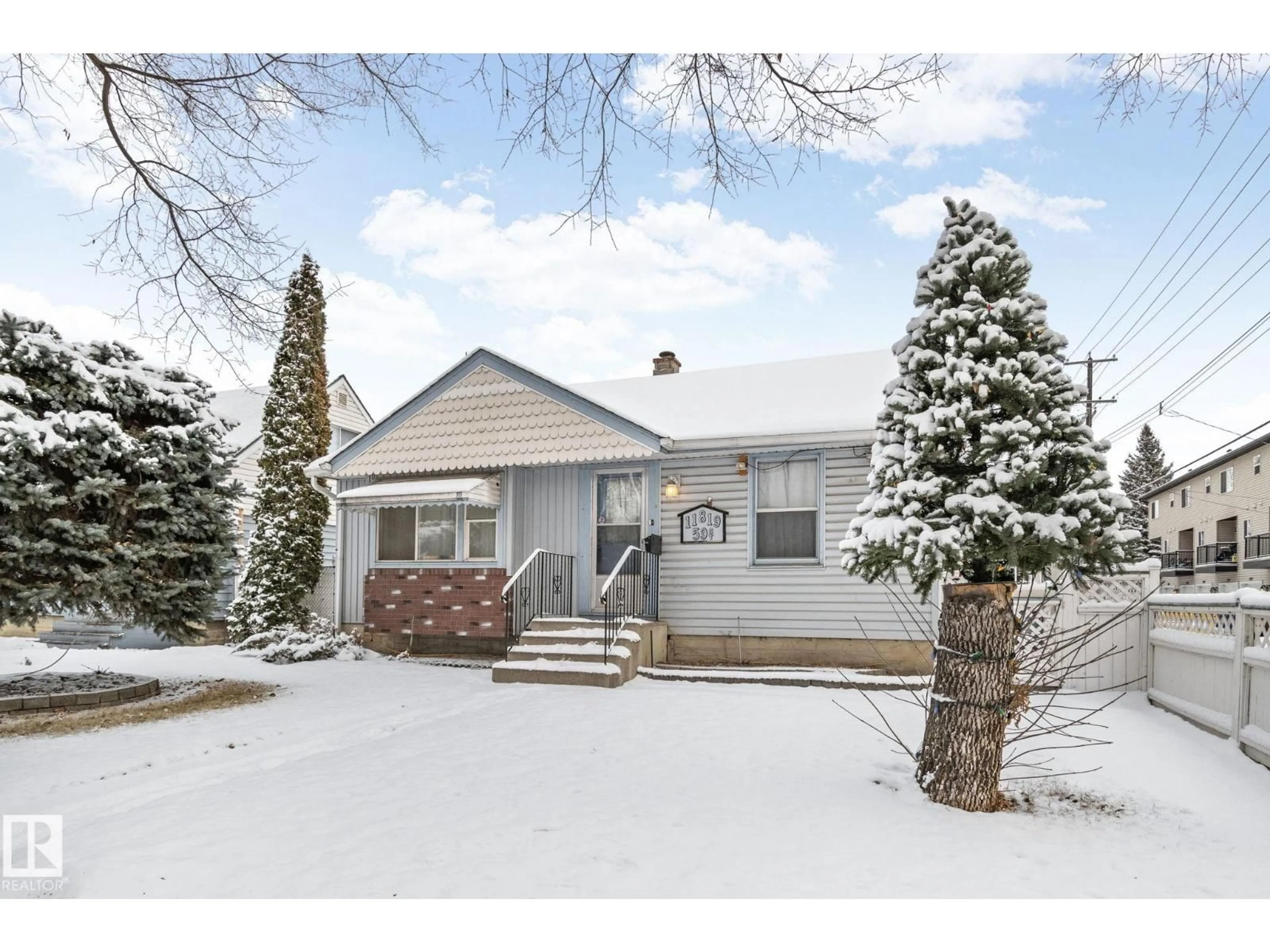 Home with vinyl exterior material, street for 11819 59 ST, Edmonton Alberta T5W3X8