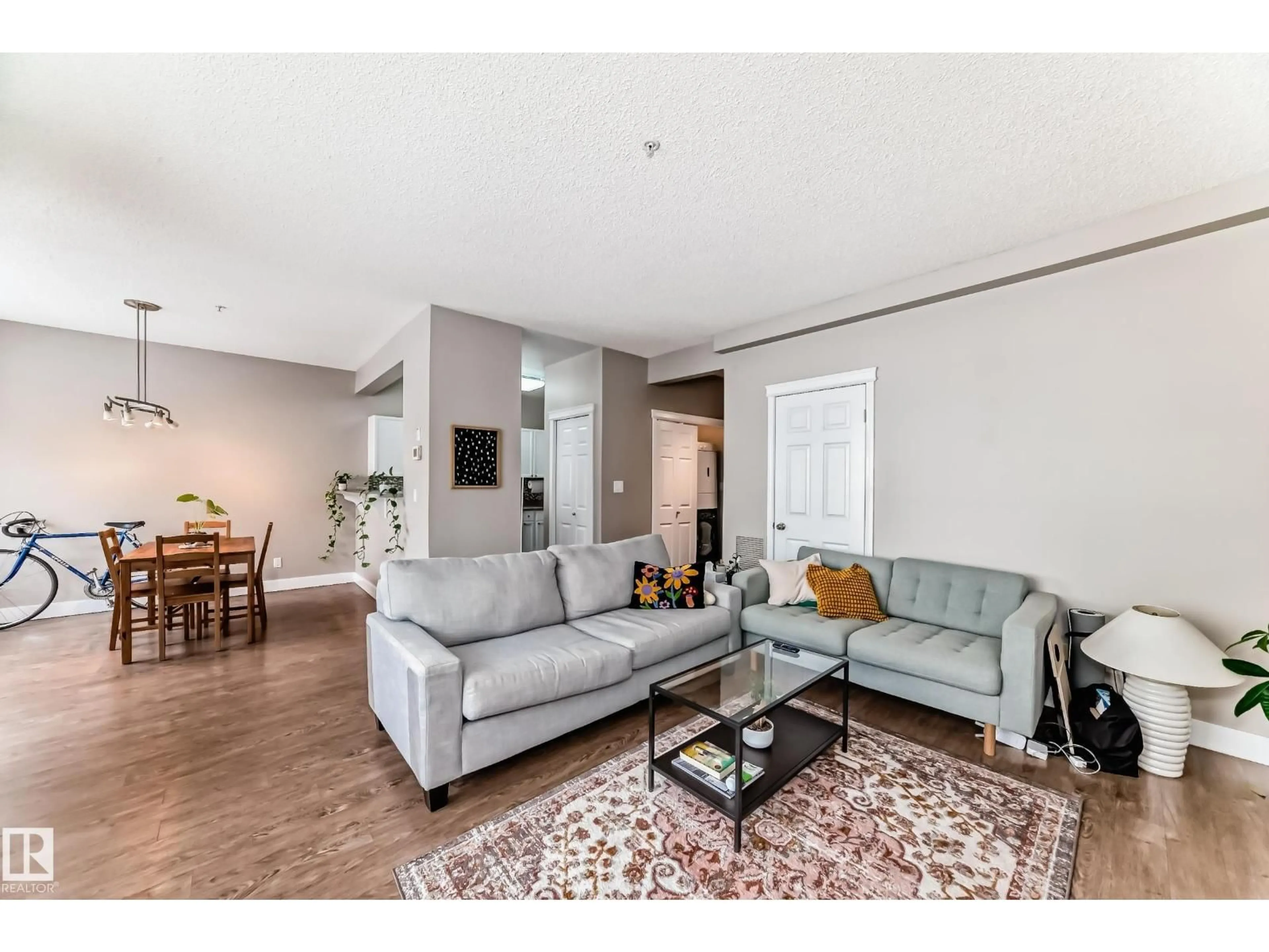Living room with furniture, wood/laminate floor for #203 - 8108 109 ST, Edmonton Alberta T6G2V7