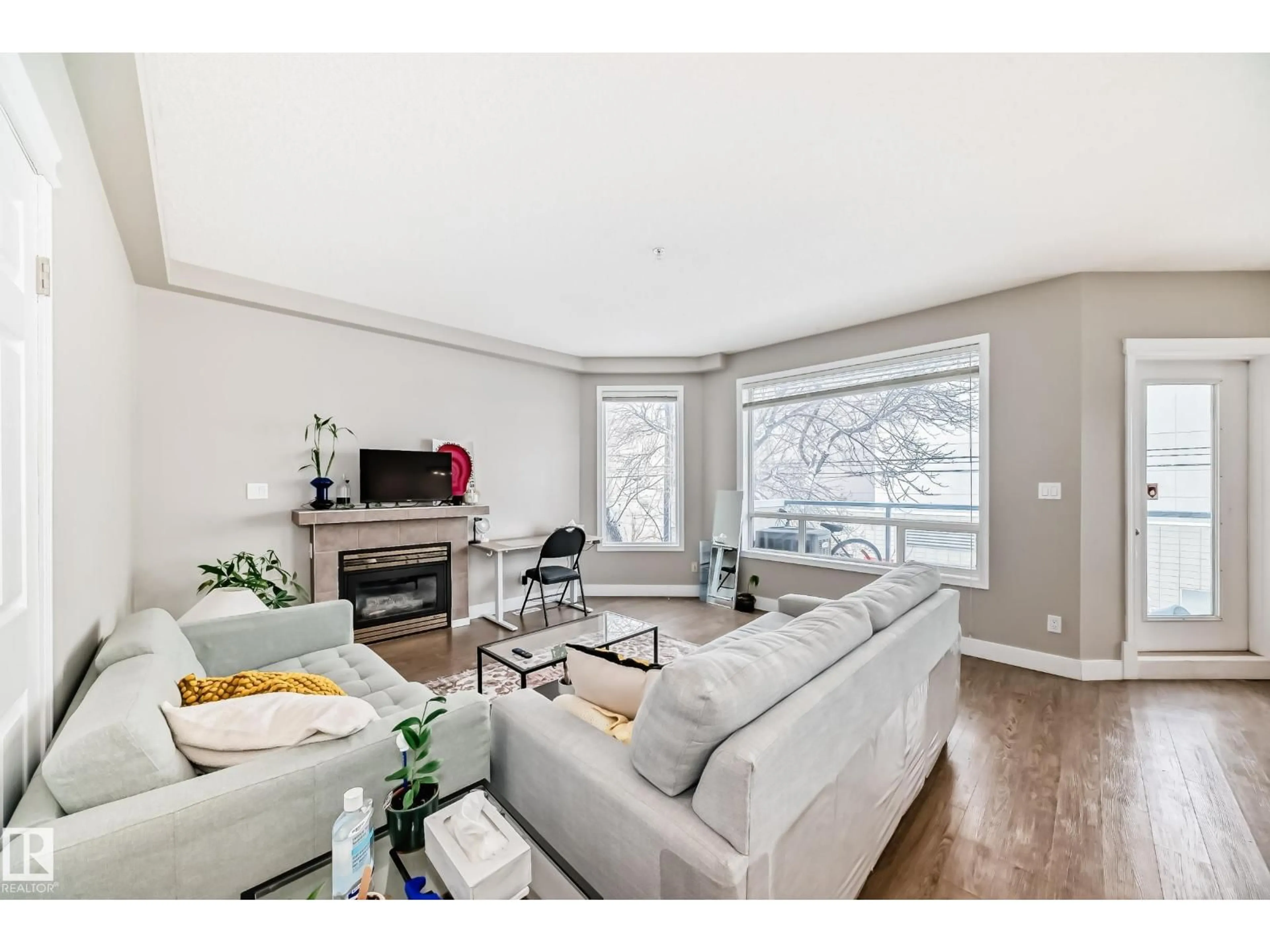 Living room with furniture, wood/laminate floor for #203 - 8108 109 ST, Edmonton Alberta T6G2V7