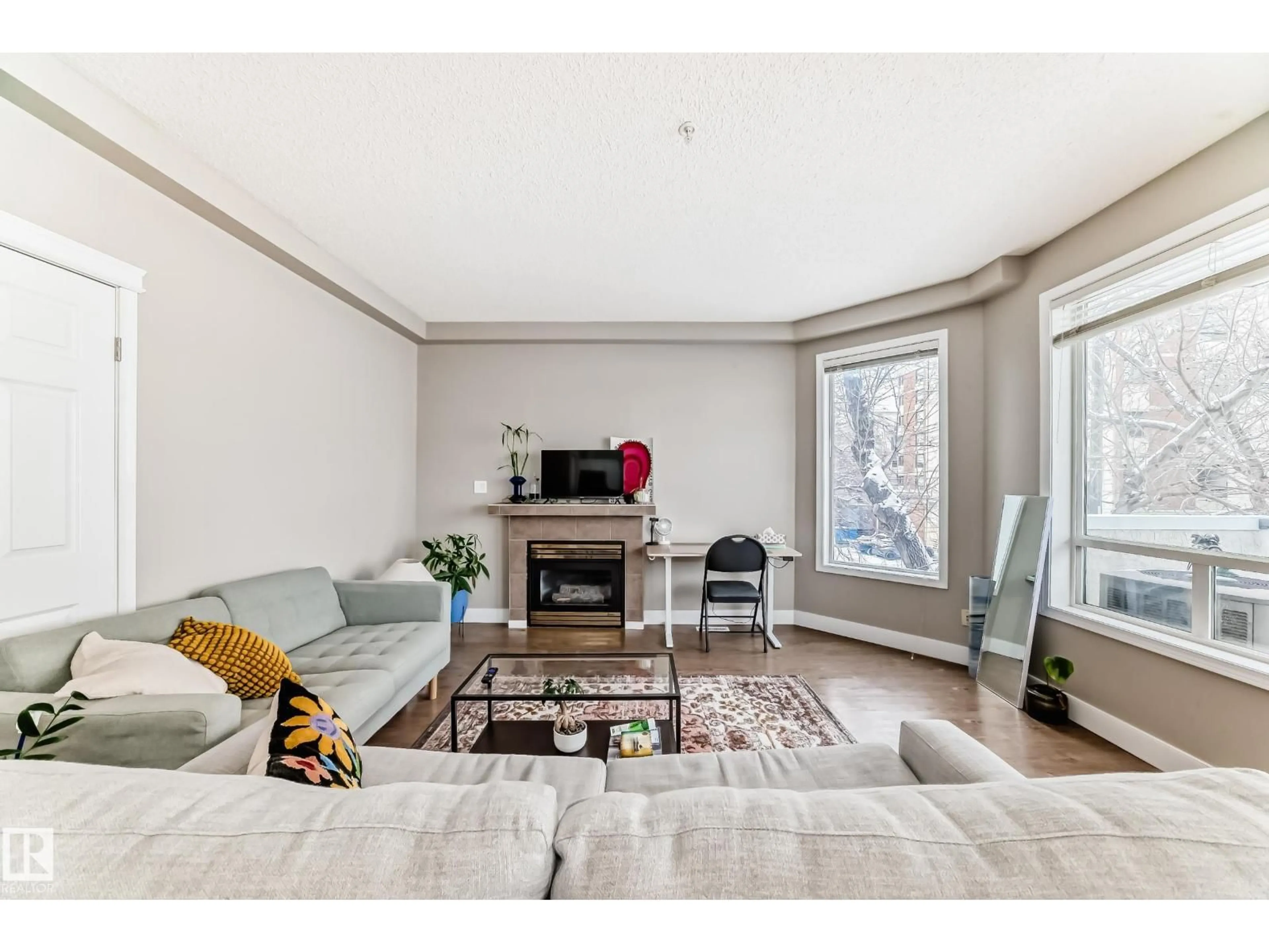 Living room with furniture, wood/laminate floor for #203 - 8108 109 ST, Edmonton Alberta T6G2V7