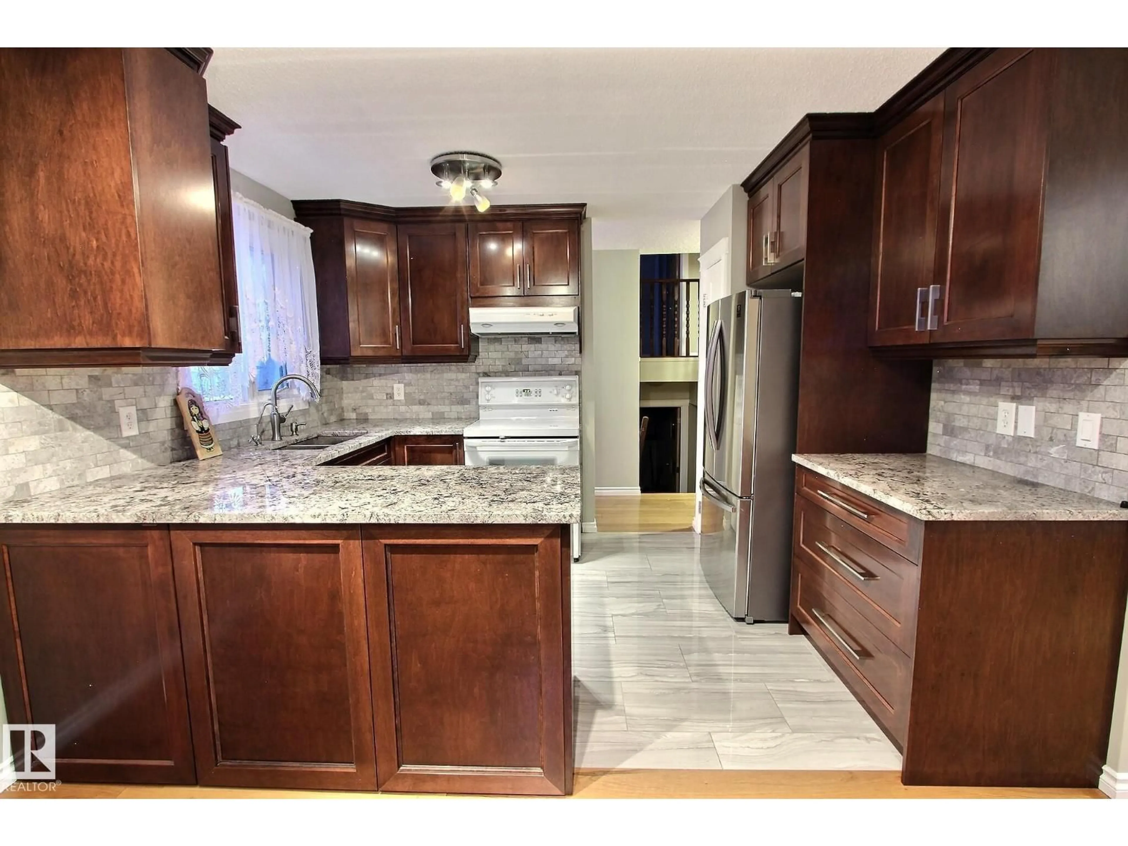 Open concept kitchen, ceramic/tile floor for 14608 29A ST NW, Edmonton Alberta T5Y2A2