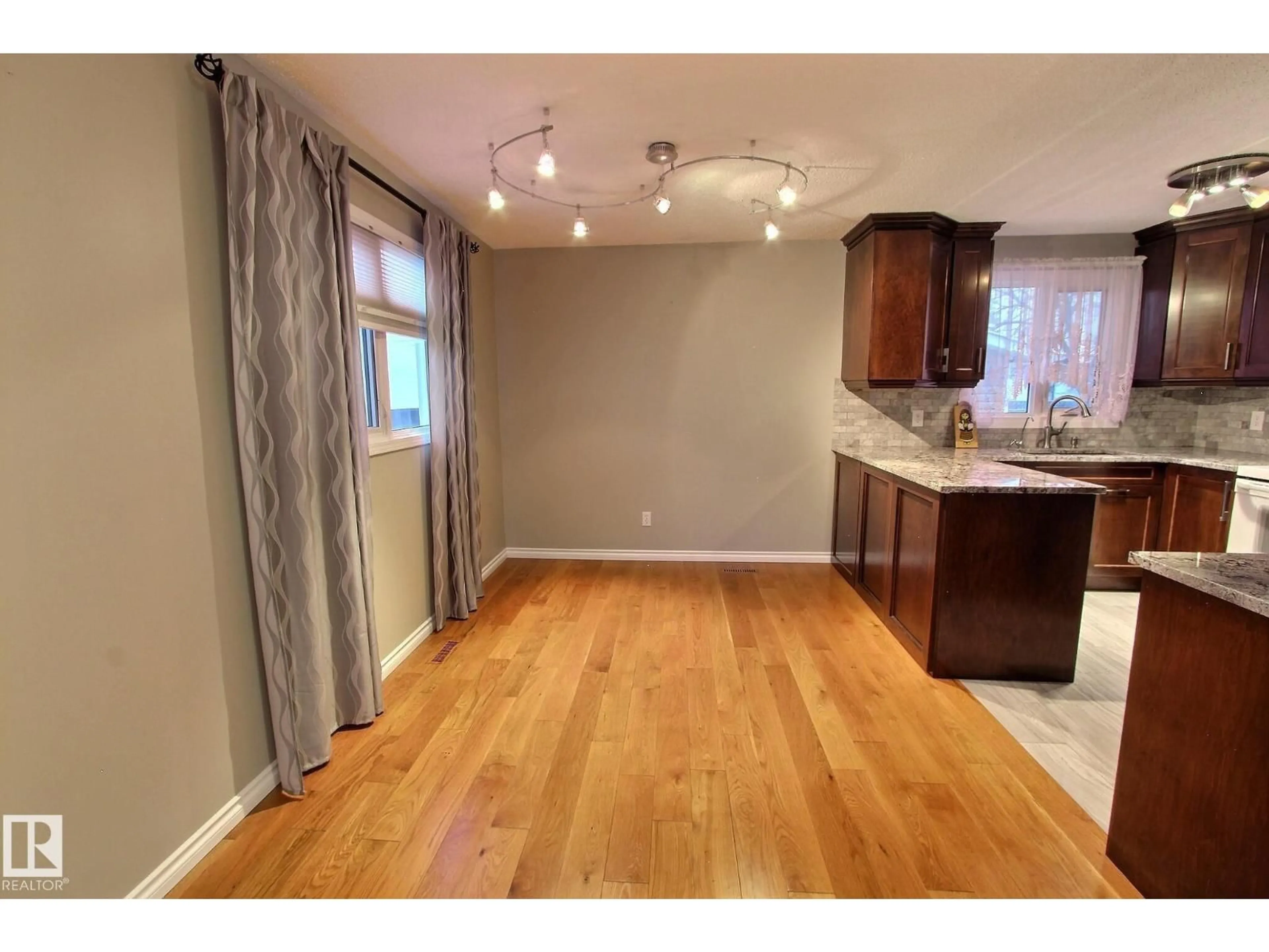 Open concept kitchen, wood/laminate floor for 14608 29A ST NW, Edmonton Alberta T5Y2A2