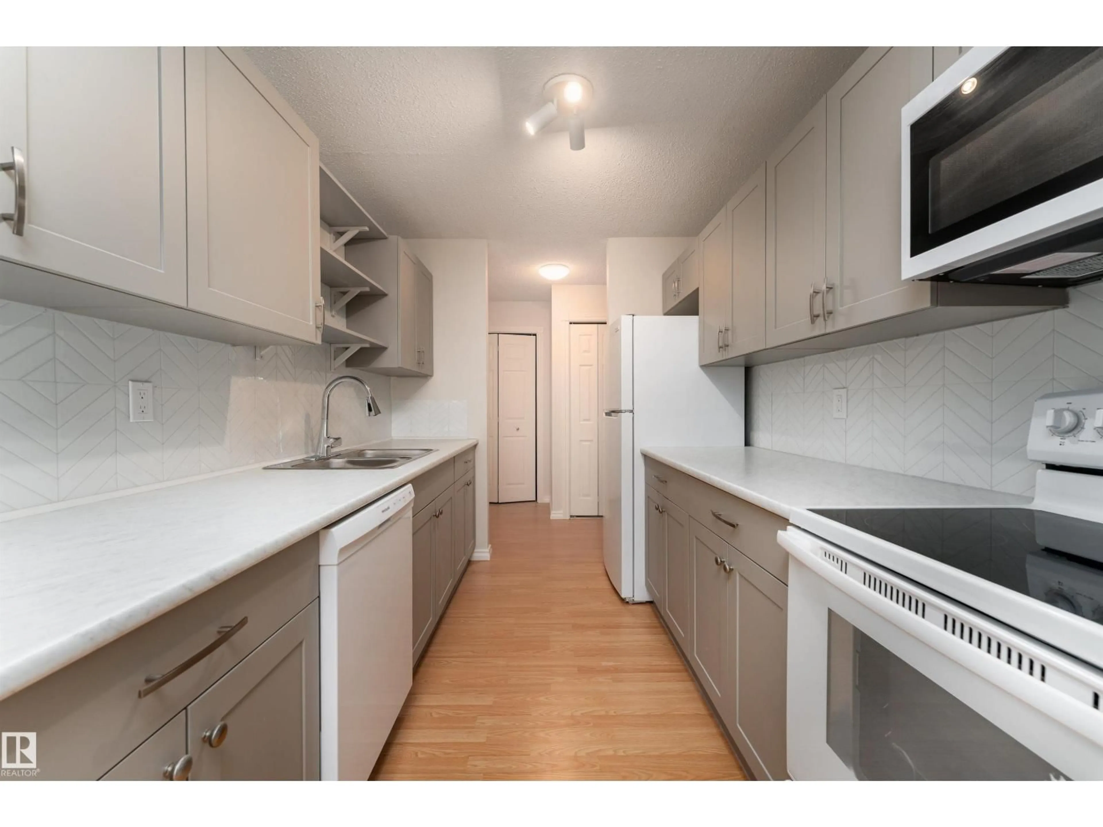 Standard kitchen, wood/laminate floor for 317 JUBILEE DR, Fort Saskatchewan Alberta T8L2M1