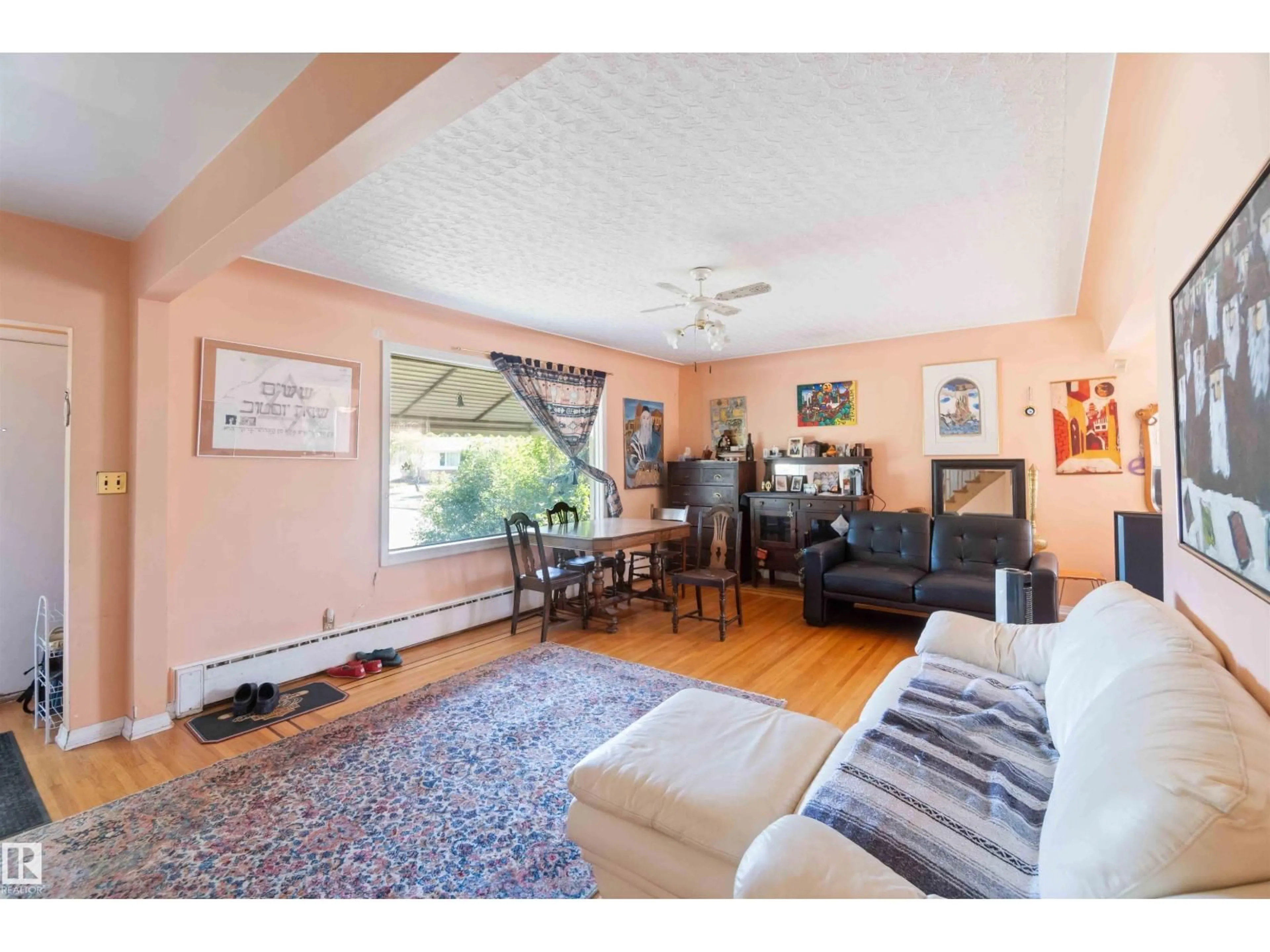 Living room with furniture, unknown for NW - 11022 110 AV, Edmonton Alberta T5H1H9