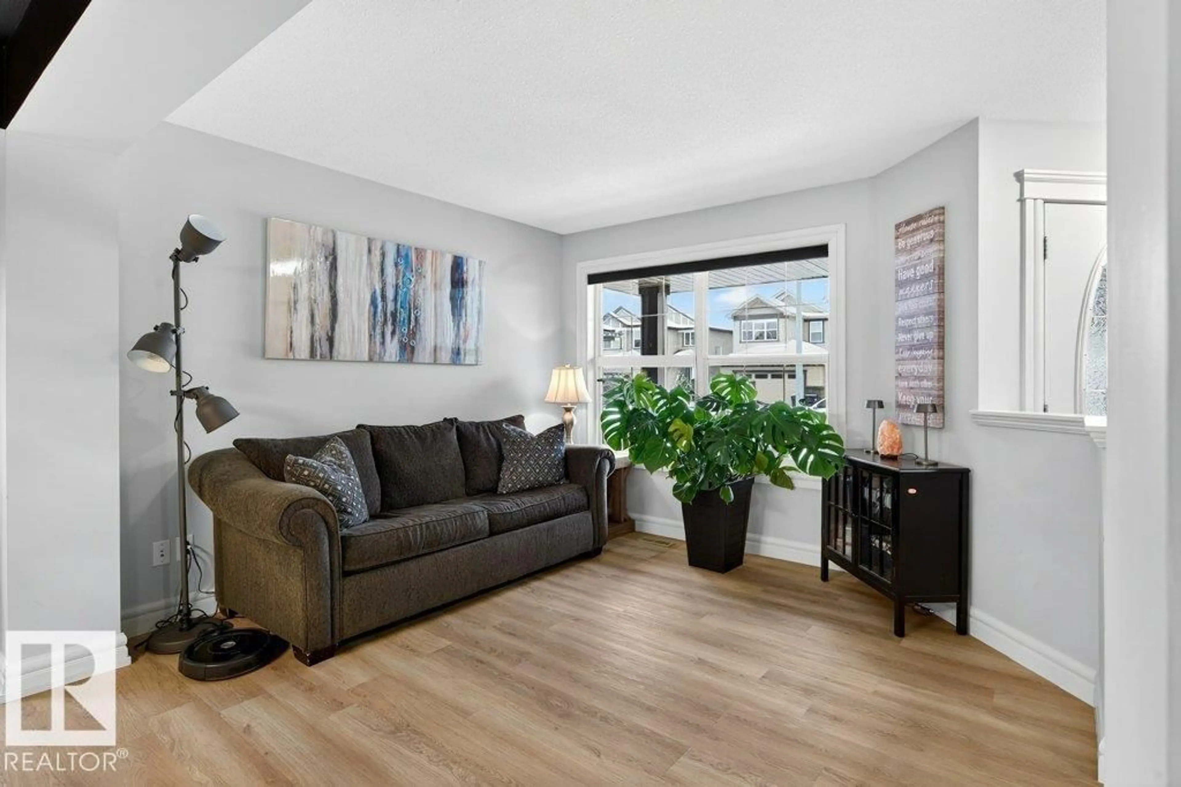 Living room with furniture, wood/laminate floor for 24 HICKORY TR, Spruce Grove Alberta T7X0A6