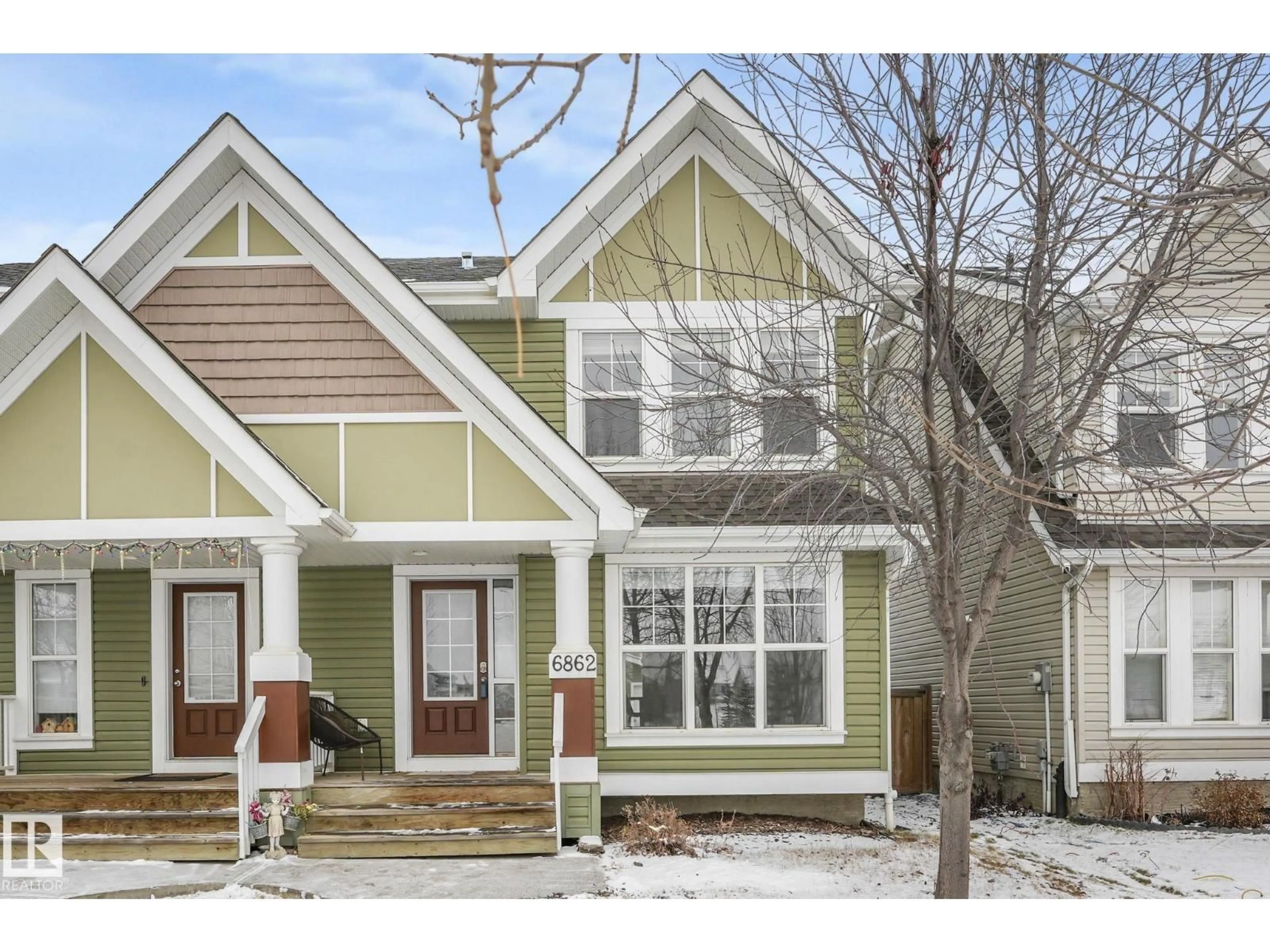 Home with vinyl exterior material, street for SW - 6862 21A AV, Edmonton Alberta T6X0S3