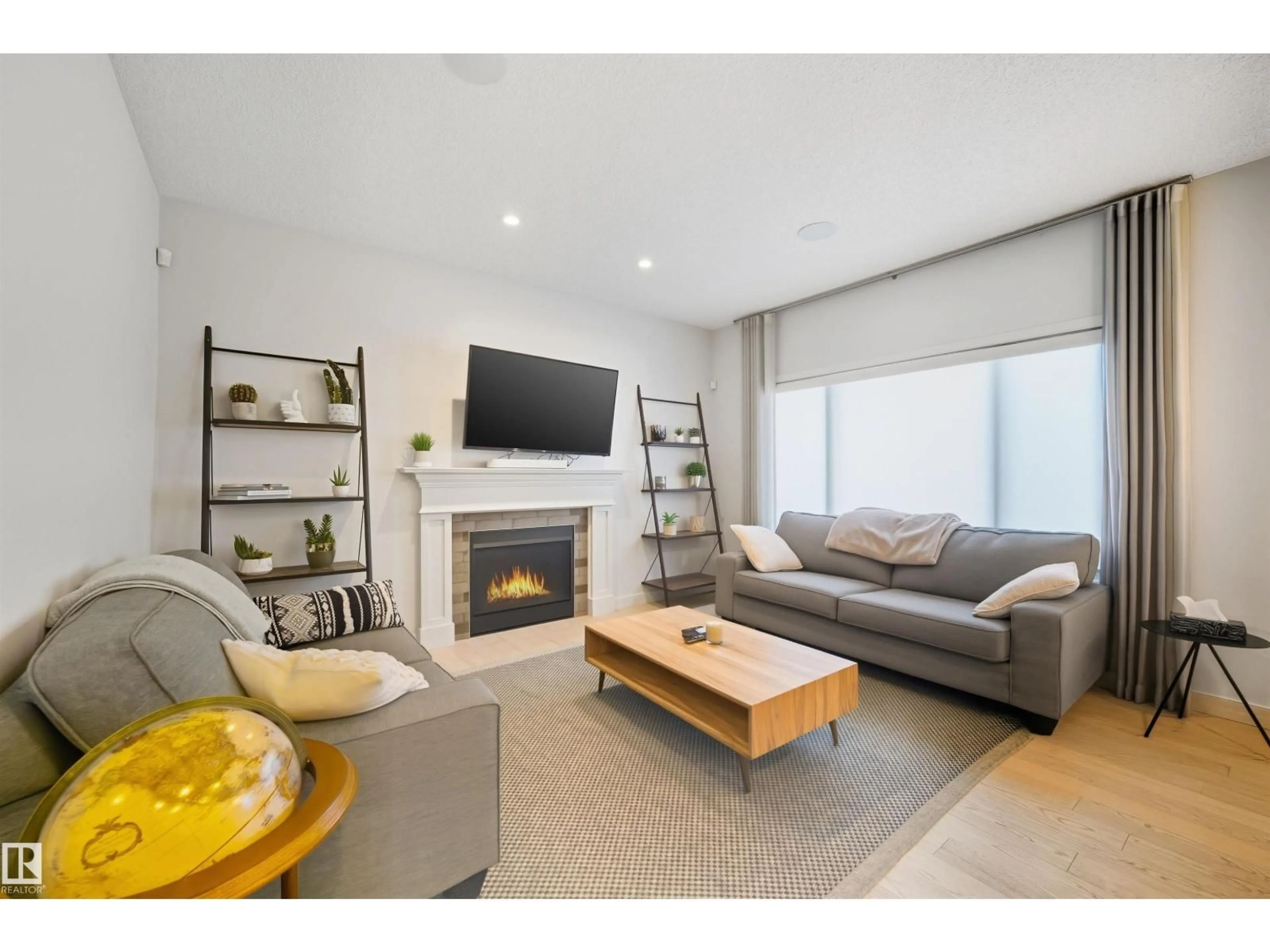 Living room with furniture, wood/laminate floor for NW - 9720 223 ST, Edmonton Alberta T5T7B7