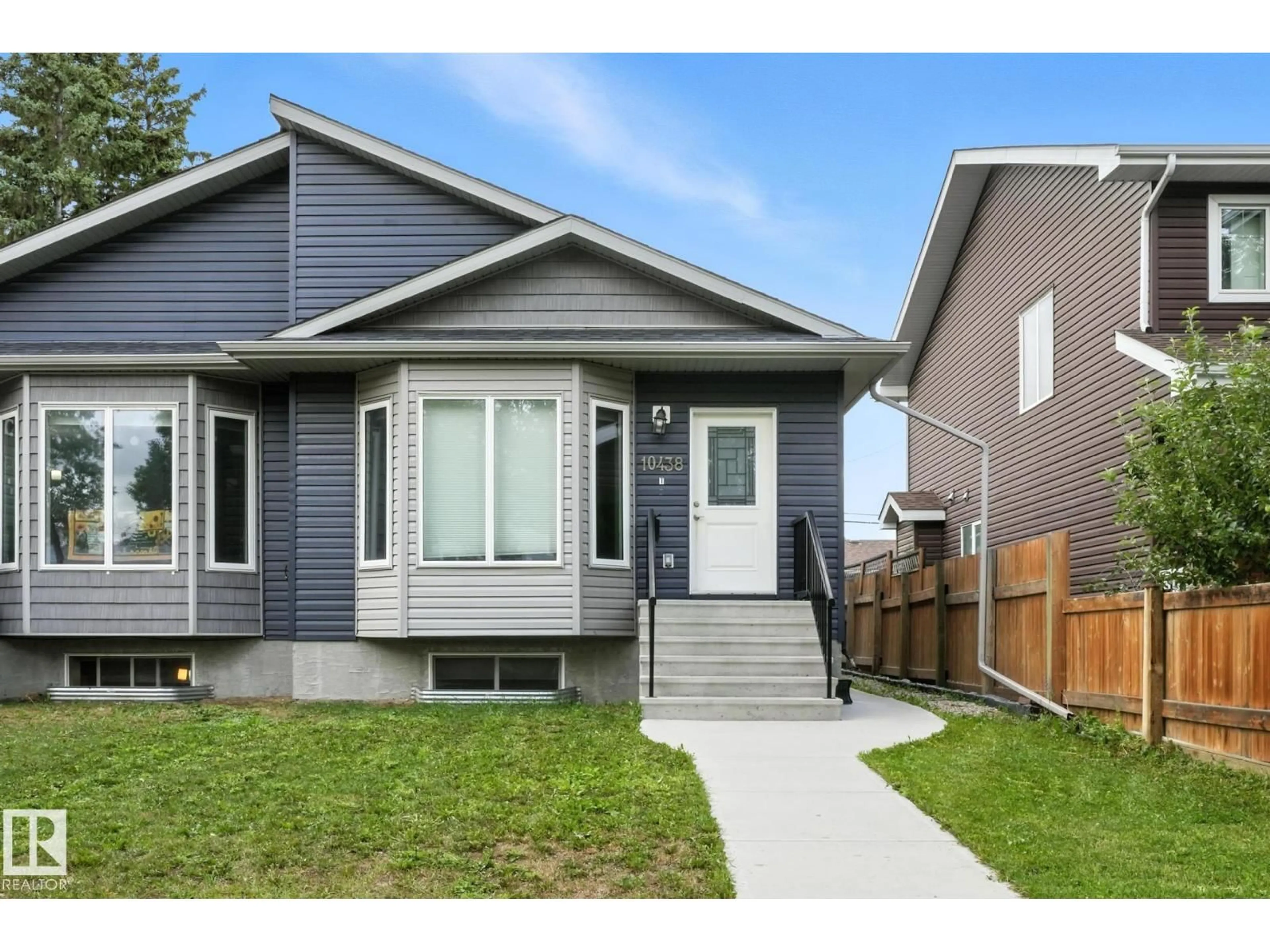 Home with vinyl exterior material, street for NW - 10438 154 ST, Edmonton Alberta T5P2H8