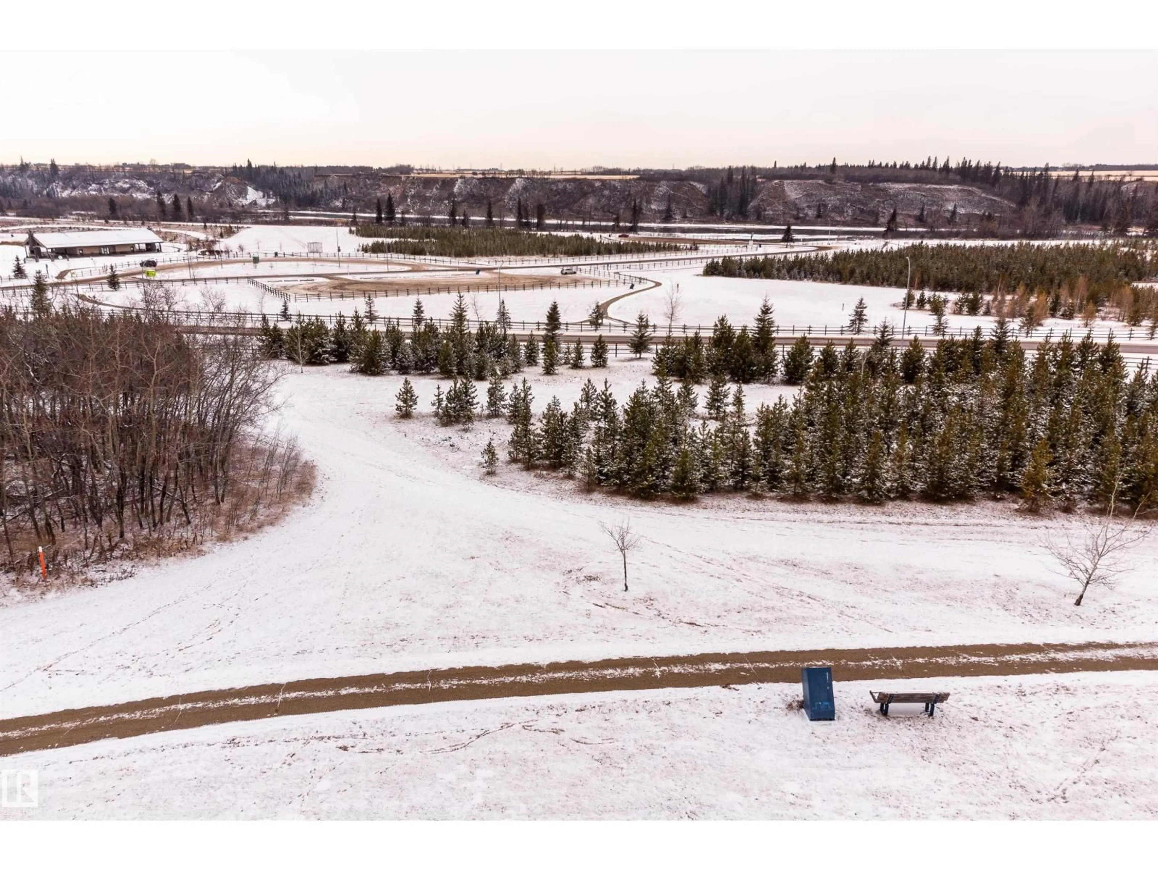 A pic from outside/outdoor area/front of a property/back of a property/a pic from drone, forest/trees view for 22 VALE TC, Fort Saskatchewan Alberta T8L0B1