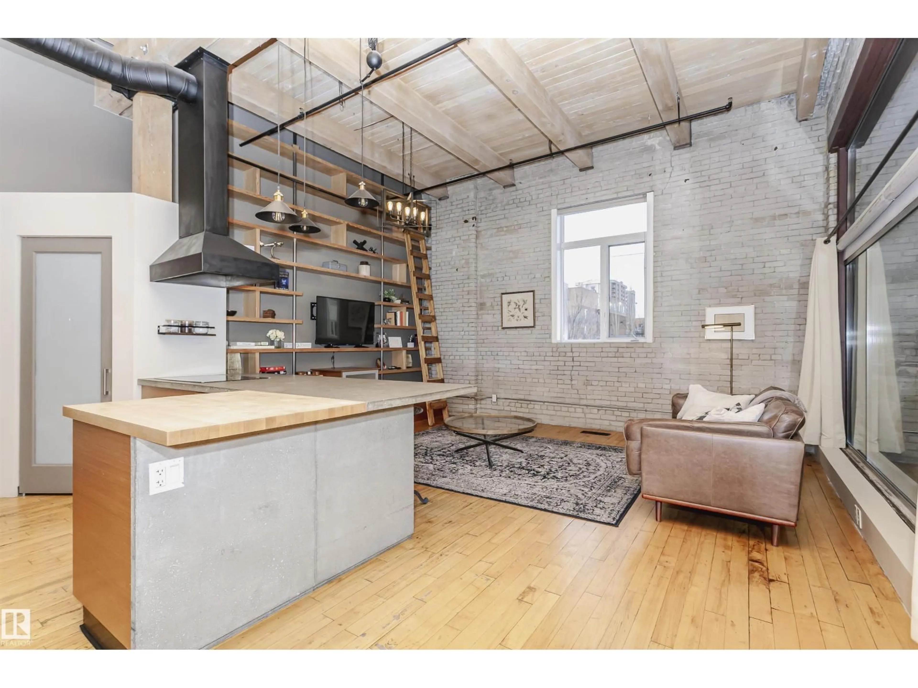 Open concept kitchen, cement floor for #118 - 10309 107 ST, Edmonton Alberta T5J1K3