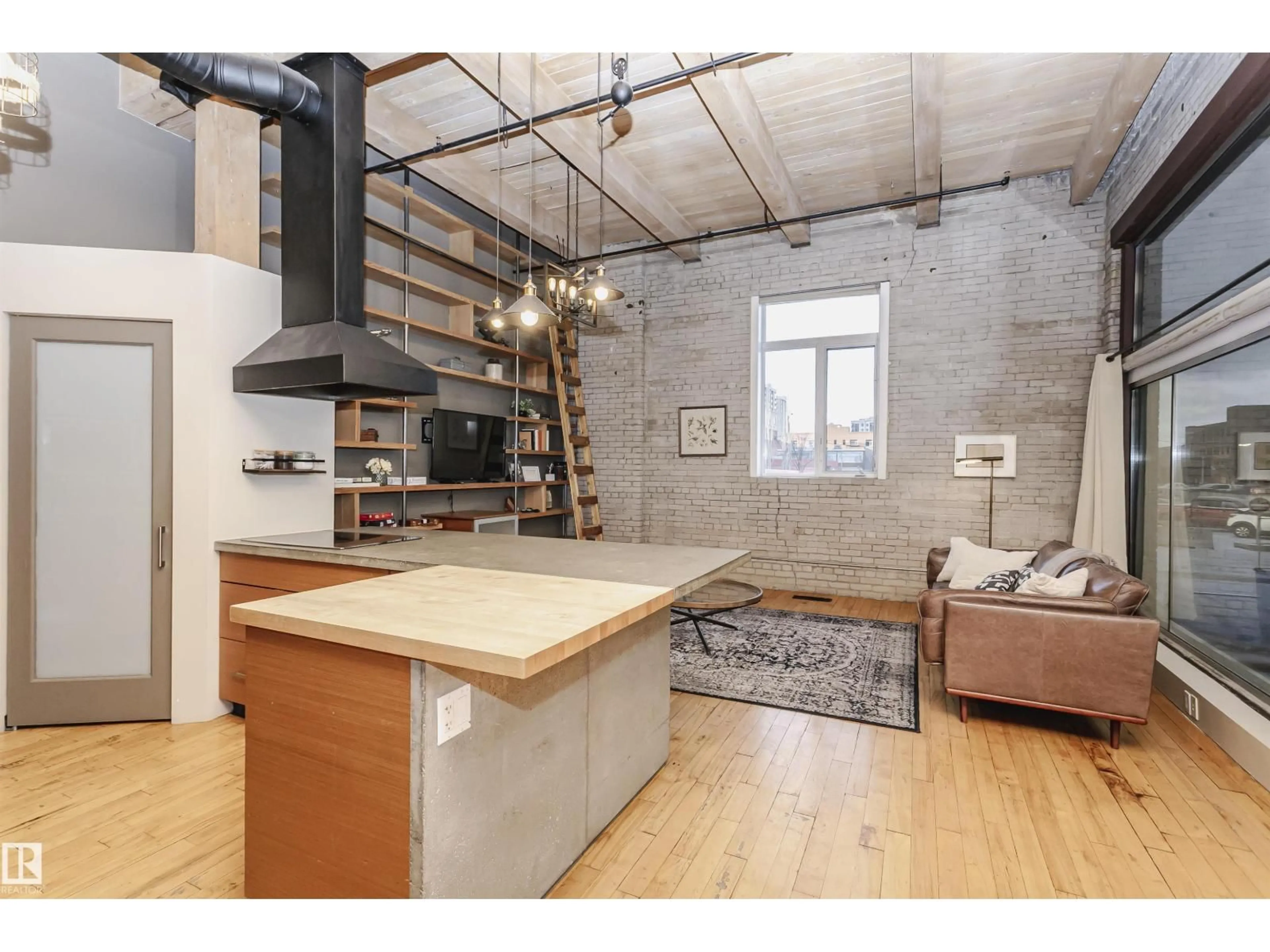 Open concept kitchen, cement floor for #118 - 10309 107 ST, Edmonton Alberta T5J1K3