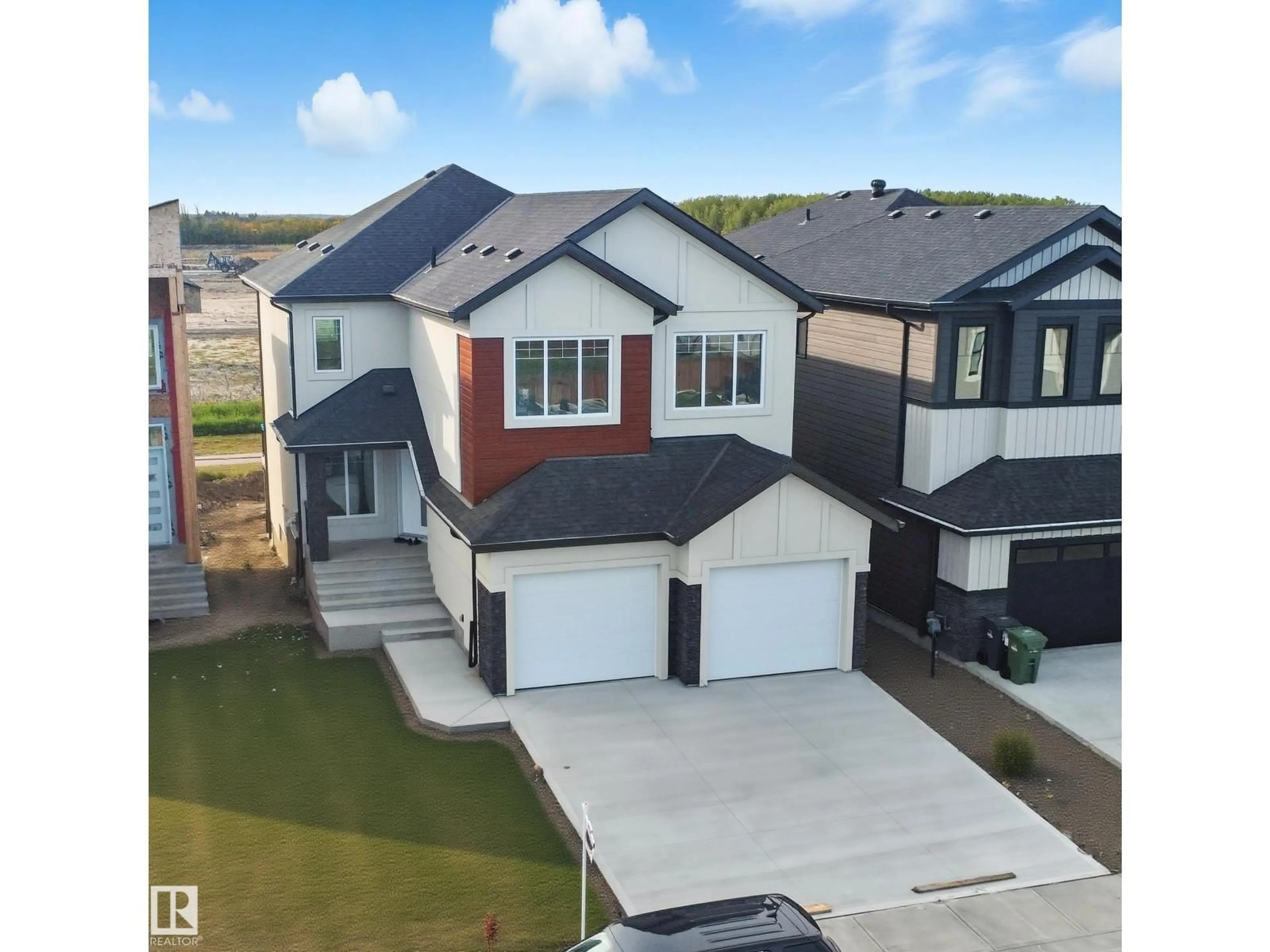 A pic from outside/outdoor area/front of a property/back of a property/a pic from drone, water/lake/river/ocean view for 144 EDGEWATER CIR, Leduc Alberta T9E1K5