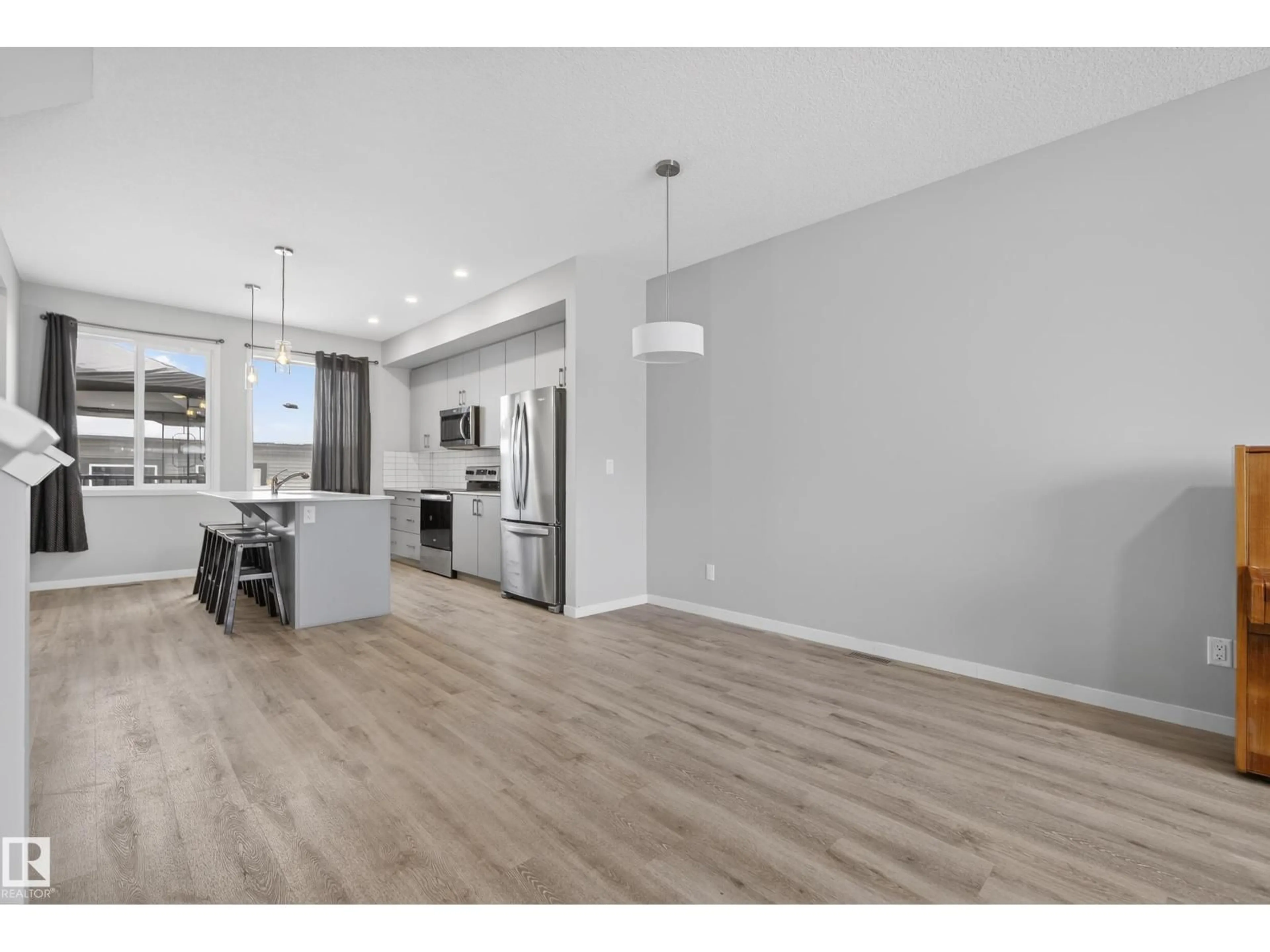 Open concept kitchen, wood/laminate floor for 5 TONEWOOD BV, Spruce Grove Alberta T7X0Z3