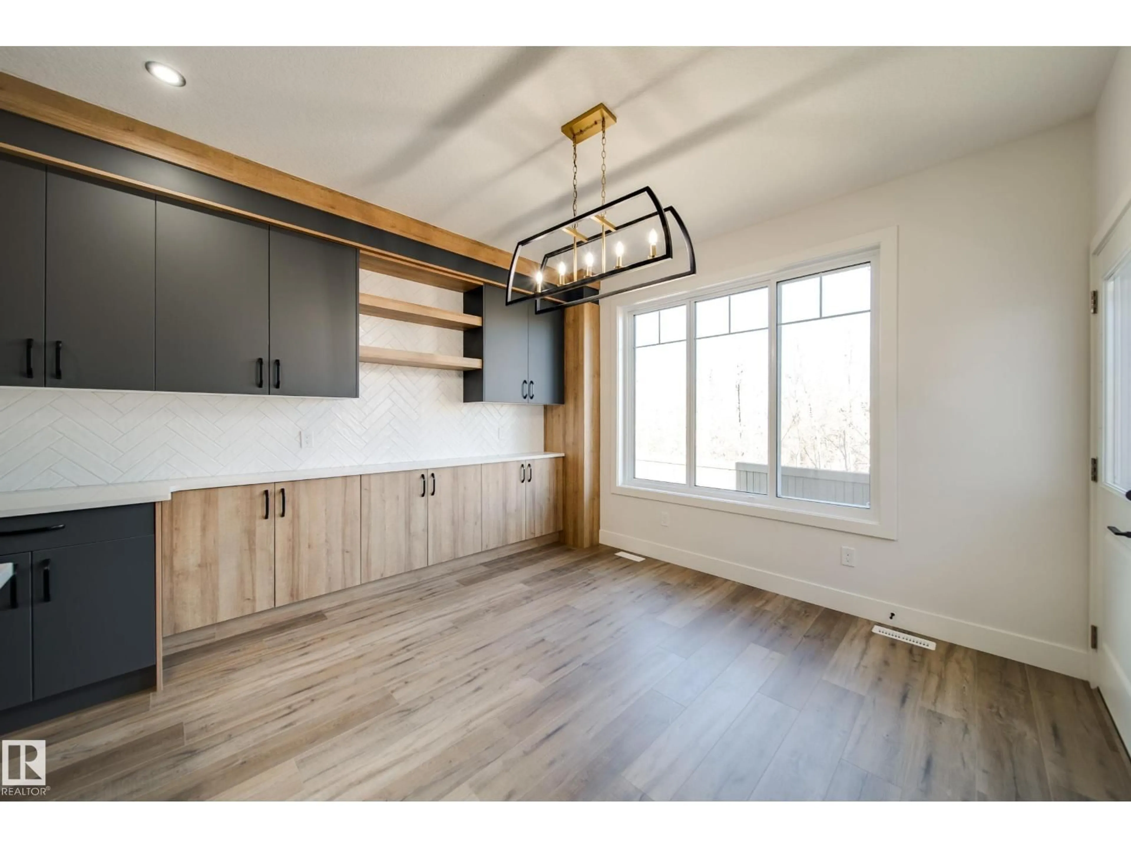 Open concept kitchen, wood/laminate floor for 49 NORWYK WY, Spruce Grove Alberta T7X4E9