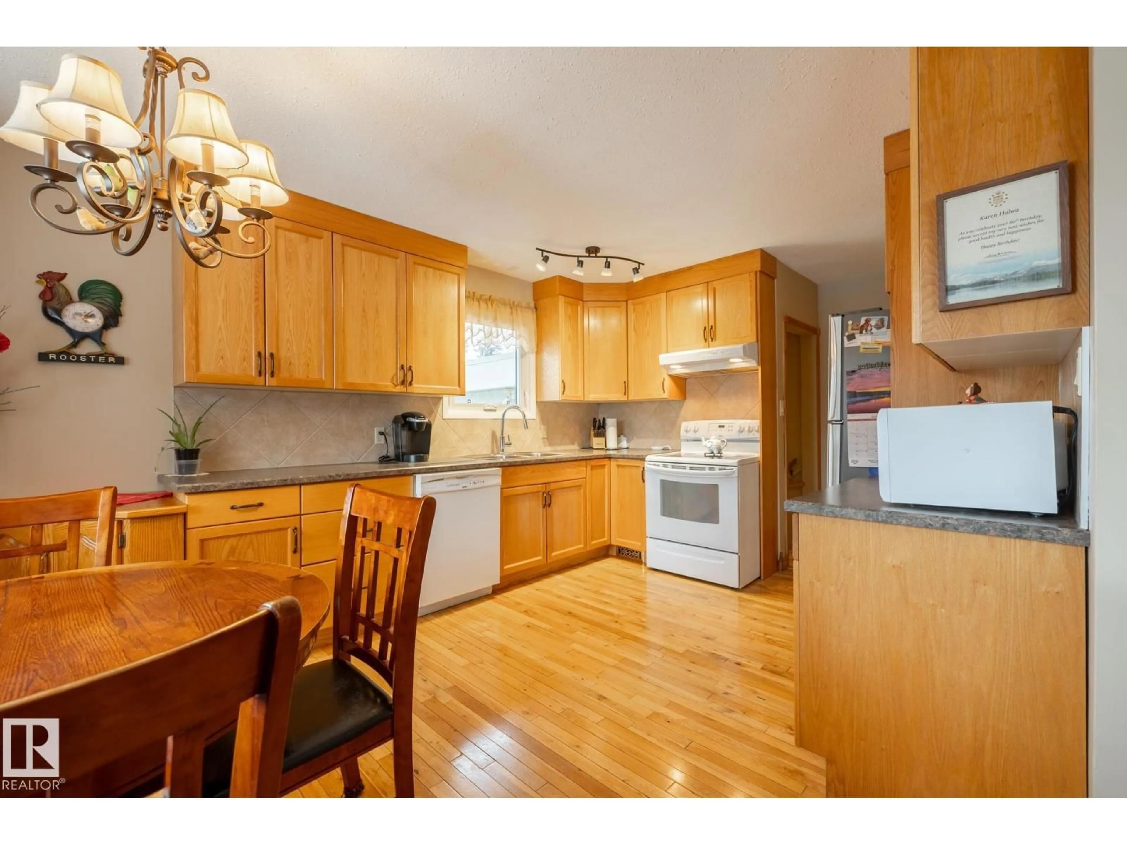 Open concept kitchen, wood/laminate floor for 4317 53 ST, Wetaskiwin Alberta T9A1P9