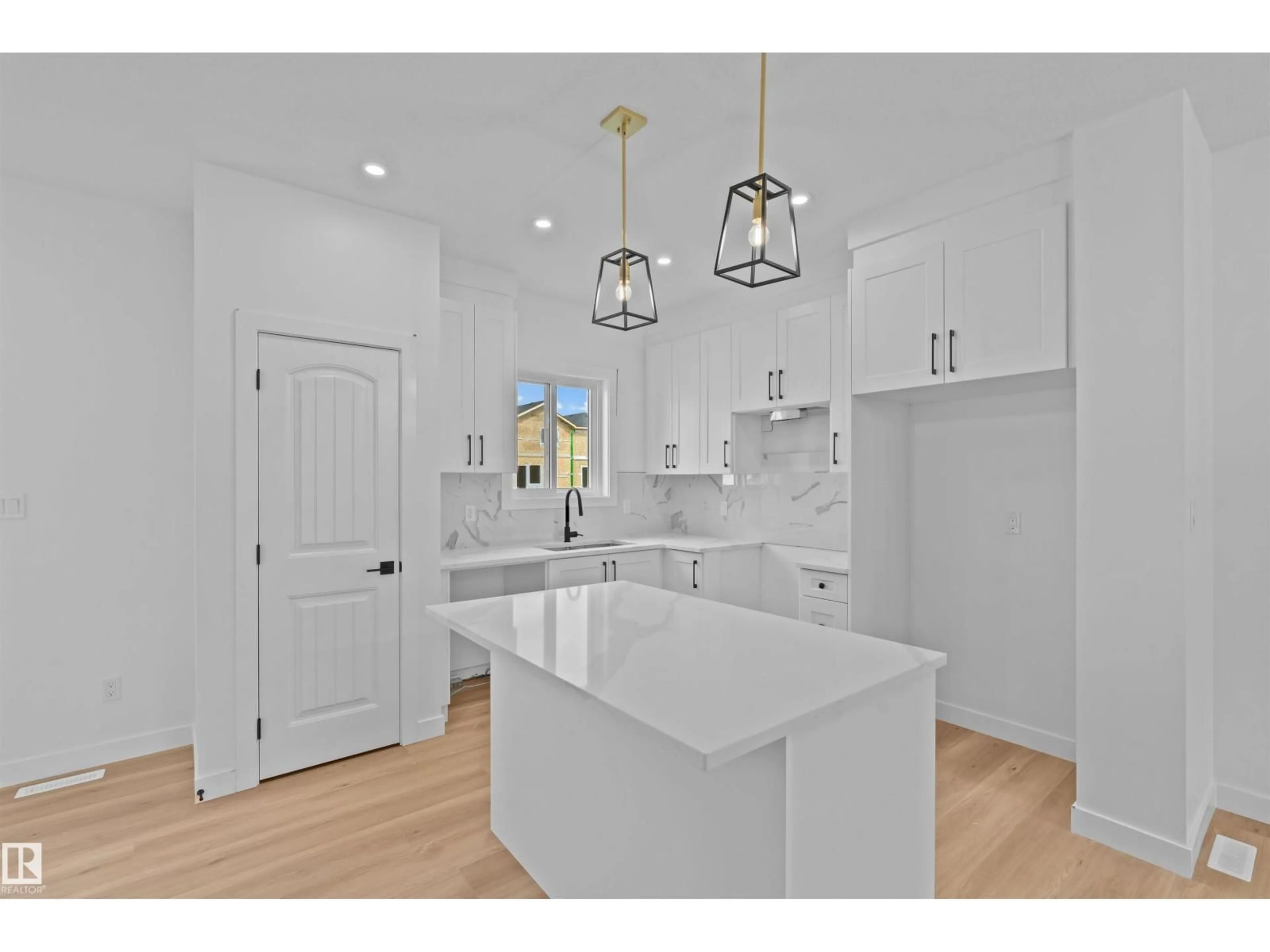 Open concept kitchen, ceramic/tile floor for 9905-9909 107 AV, Morinville Alberta T8R2R8