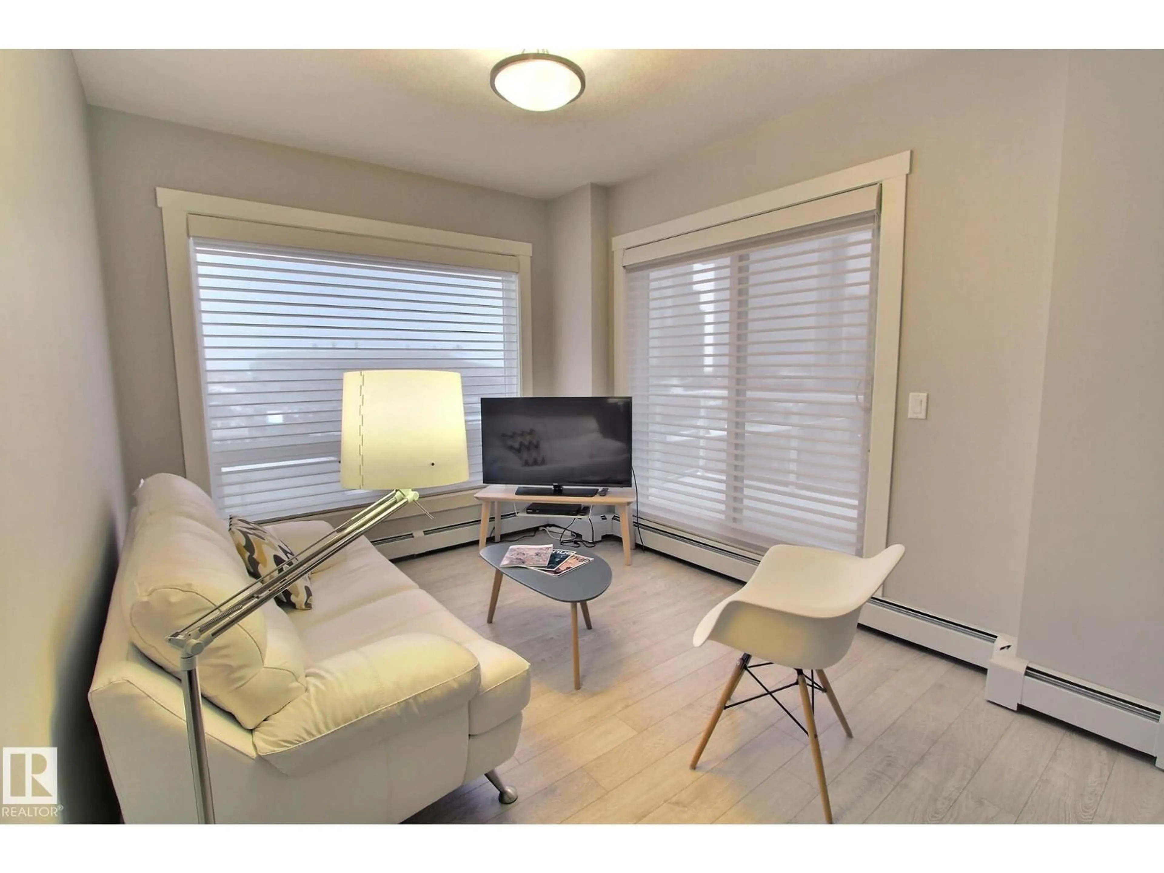 Living room with furniture, wood/laminate floor for 804 - 10226 104 ST NW, Edmonton Alberta T5J1B8