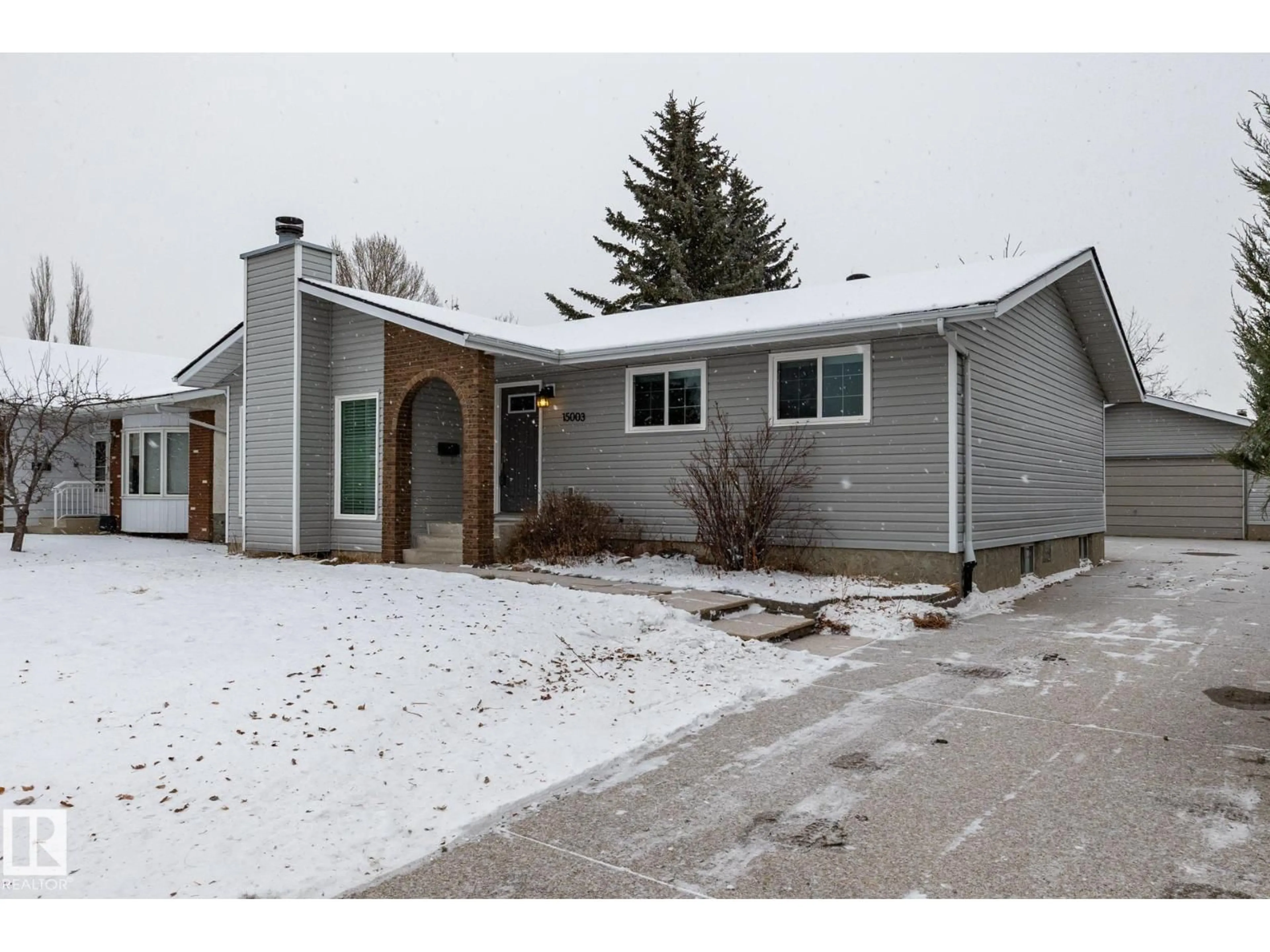 Home with vinyl exterior material, street for NW - 15003 58 ST, Edmonton Alberta T5A4H4