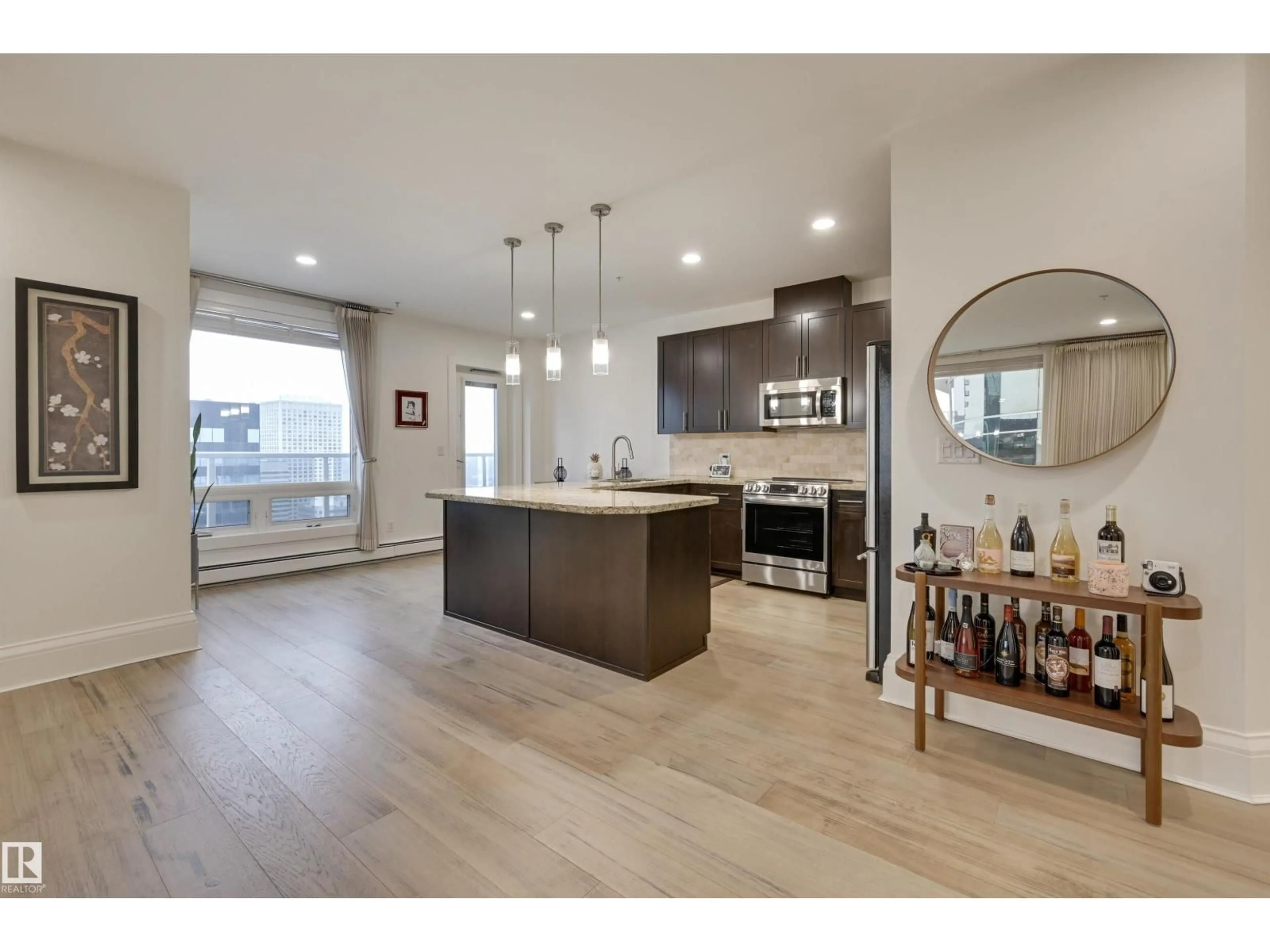 Open concept kitchen, wood/laminate floor for 10136 - 2801 104 ST NW, Edmonton Alberta T5J0B5