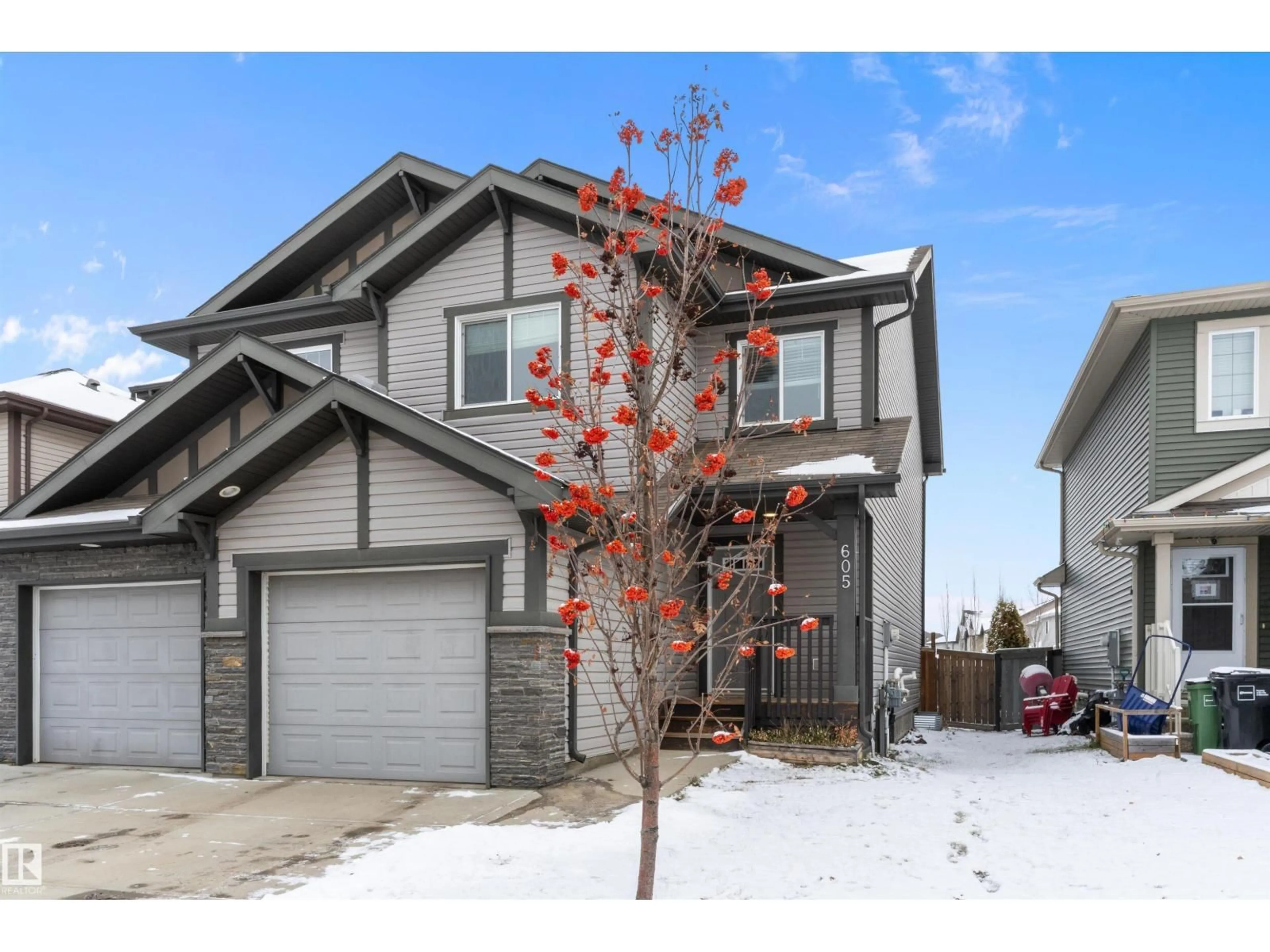 Home with vinyl exterior material, street for 605 175A ST, Edmonton Alberta T6W2G5