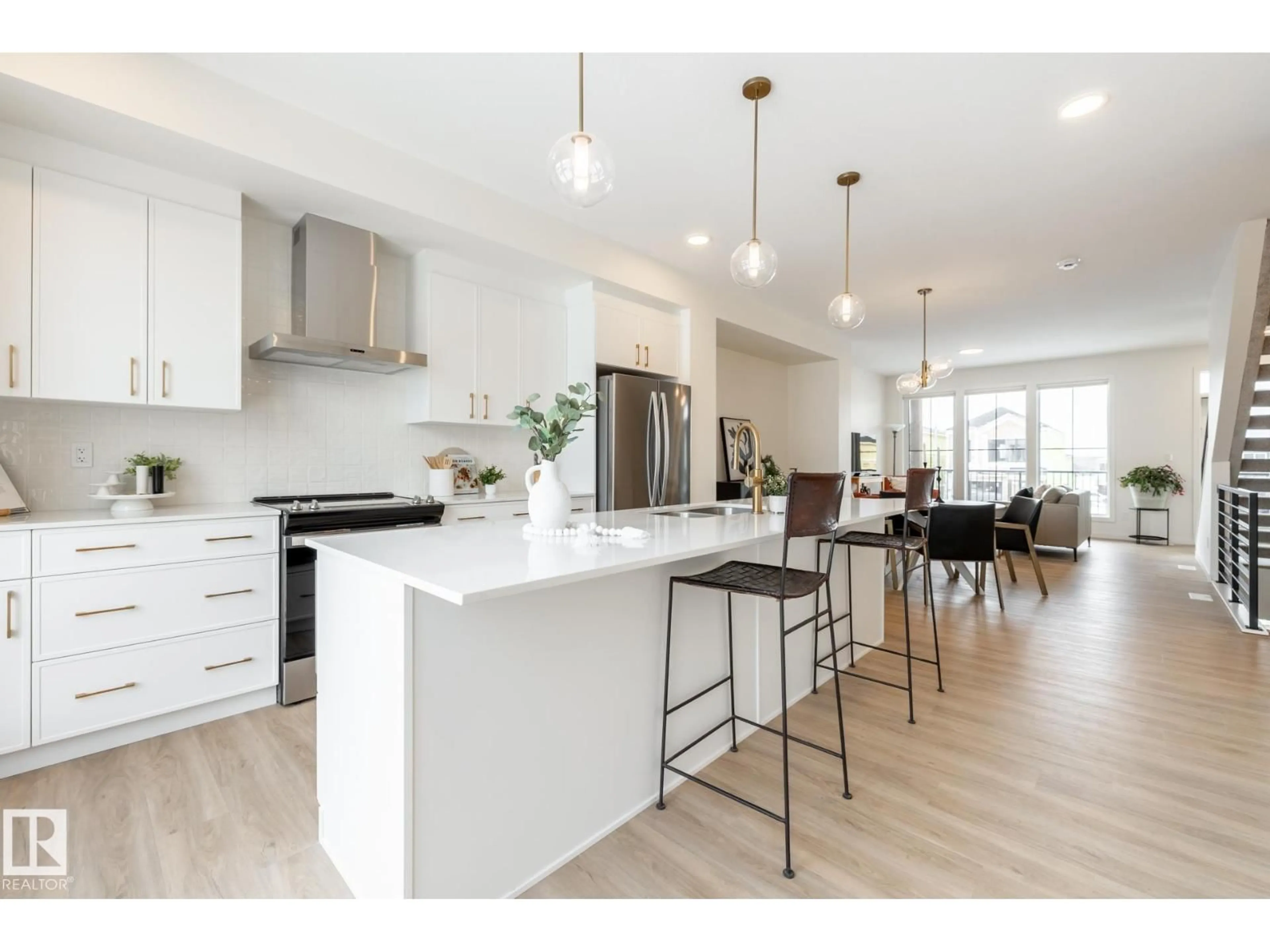 Open concept kitchen, wood/laminate floor for 7529 KLAPSTEIN LI, Edmonton Alberta T6W5T2