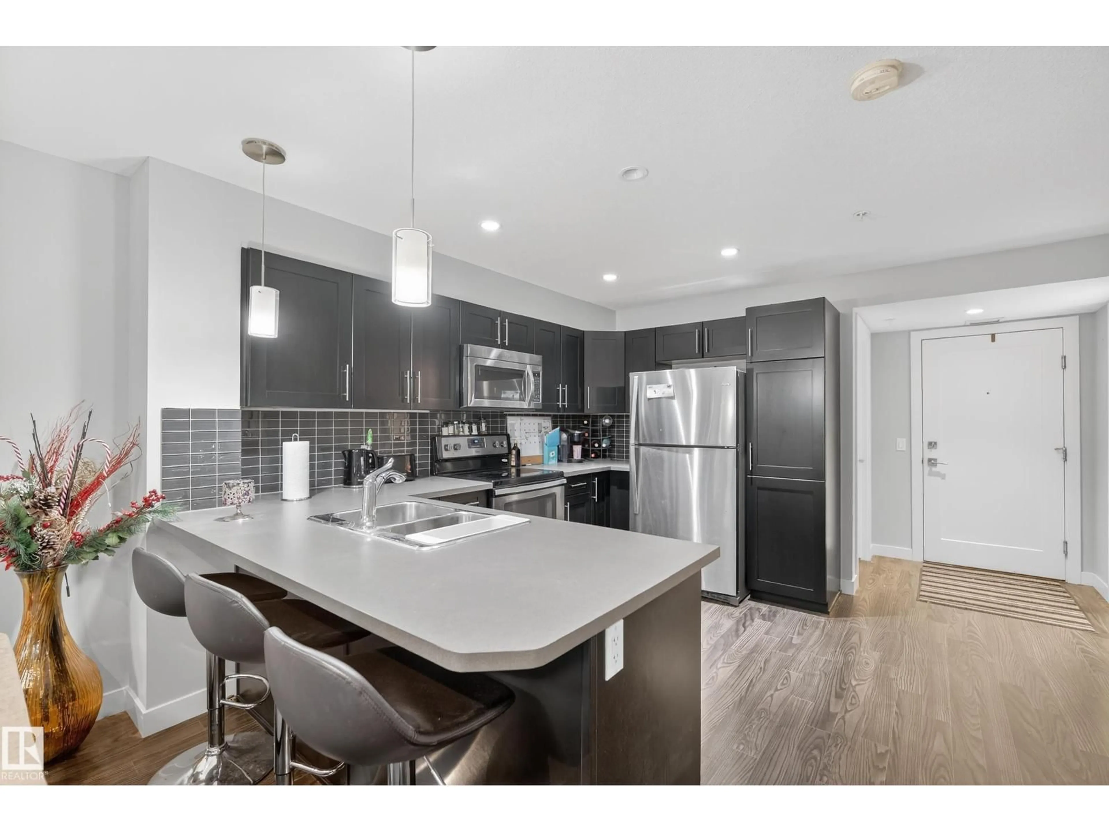 Open concept kitchen, unknown for #107 - 1031 173 ST, Edmonton Alberta T6W3E4