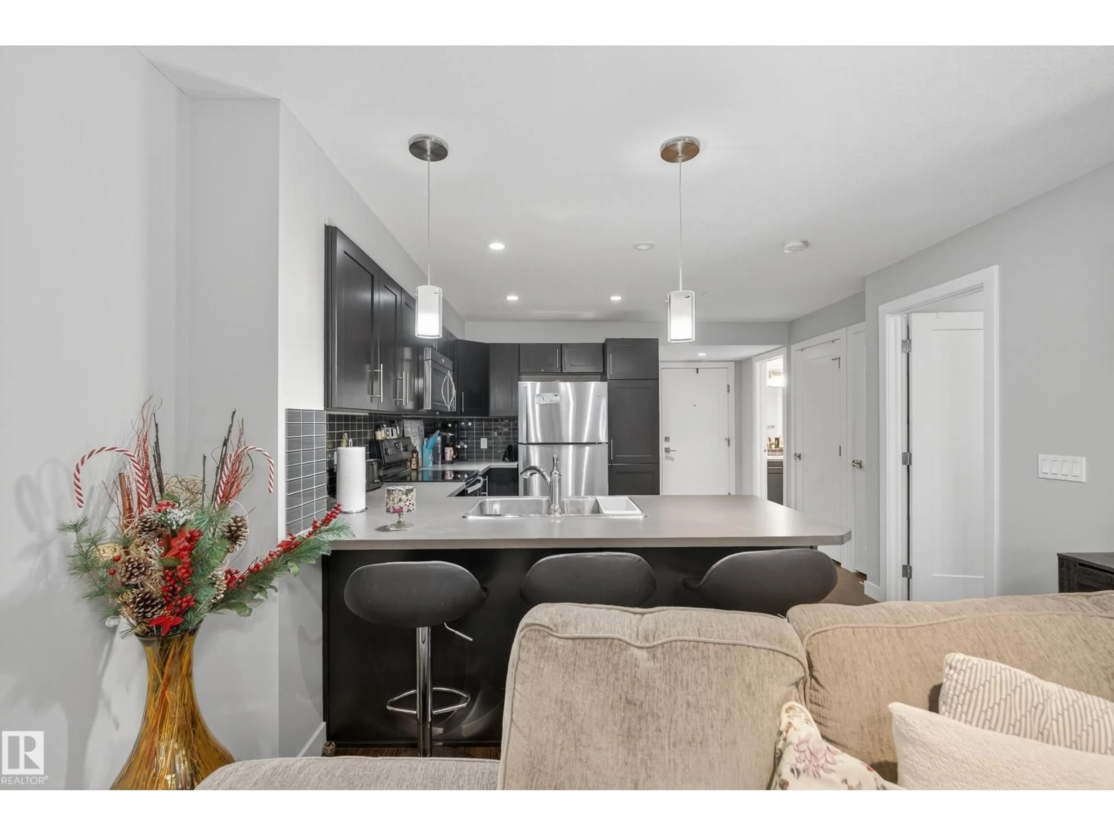 Open concept kitchen, unknown for #107 - 1031 173 ST, Edmonton Alberta T6W3E4